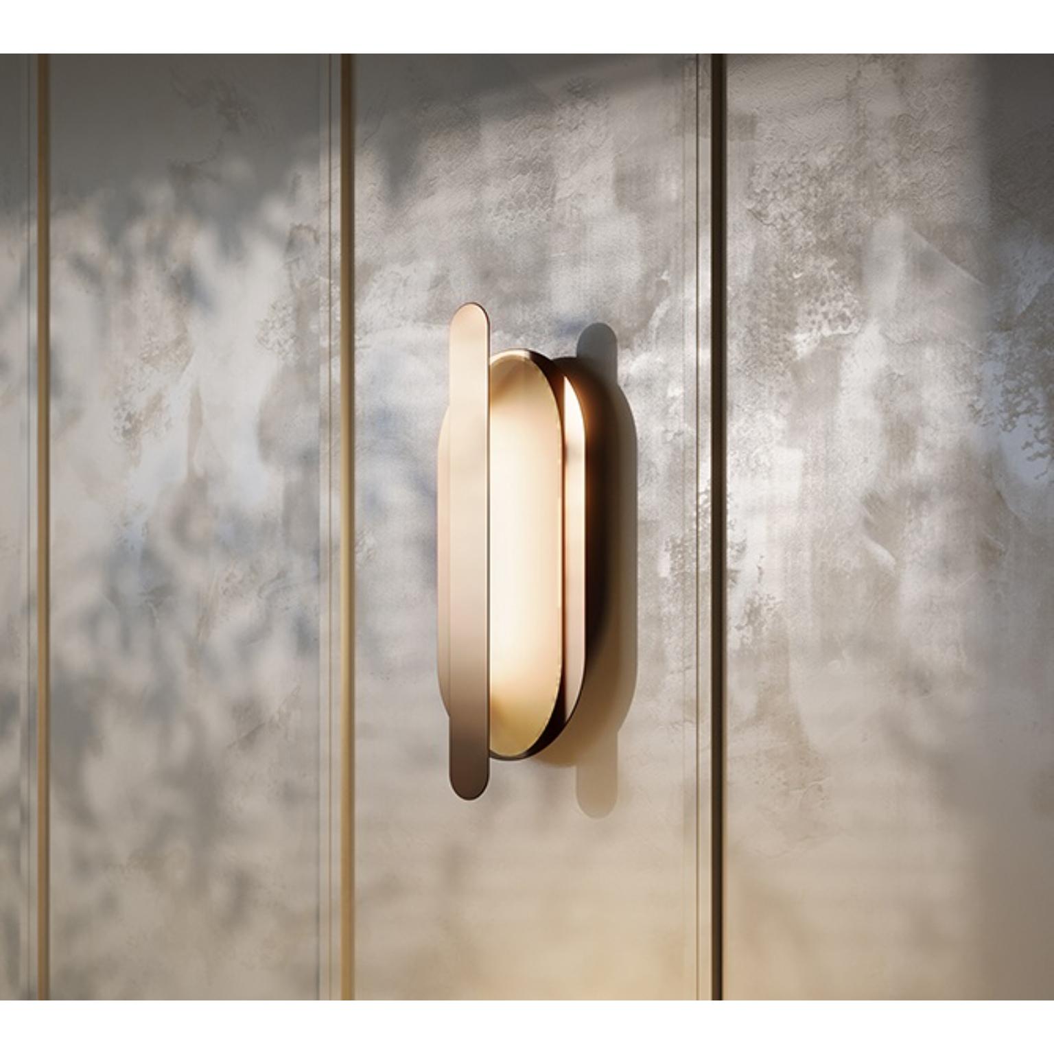 MMM Loop Wall Lamp by MM Lampadari
Dimensions: D 9 x W 15 x H 40 cm. 
Materials: Glass and metal.

Different metal finishes are available. All our lamps can be wired according to each country. If sold to the USA it will be wired for the USA for