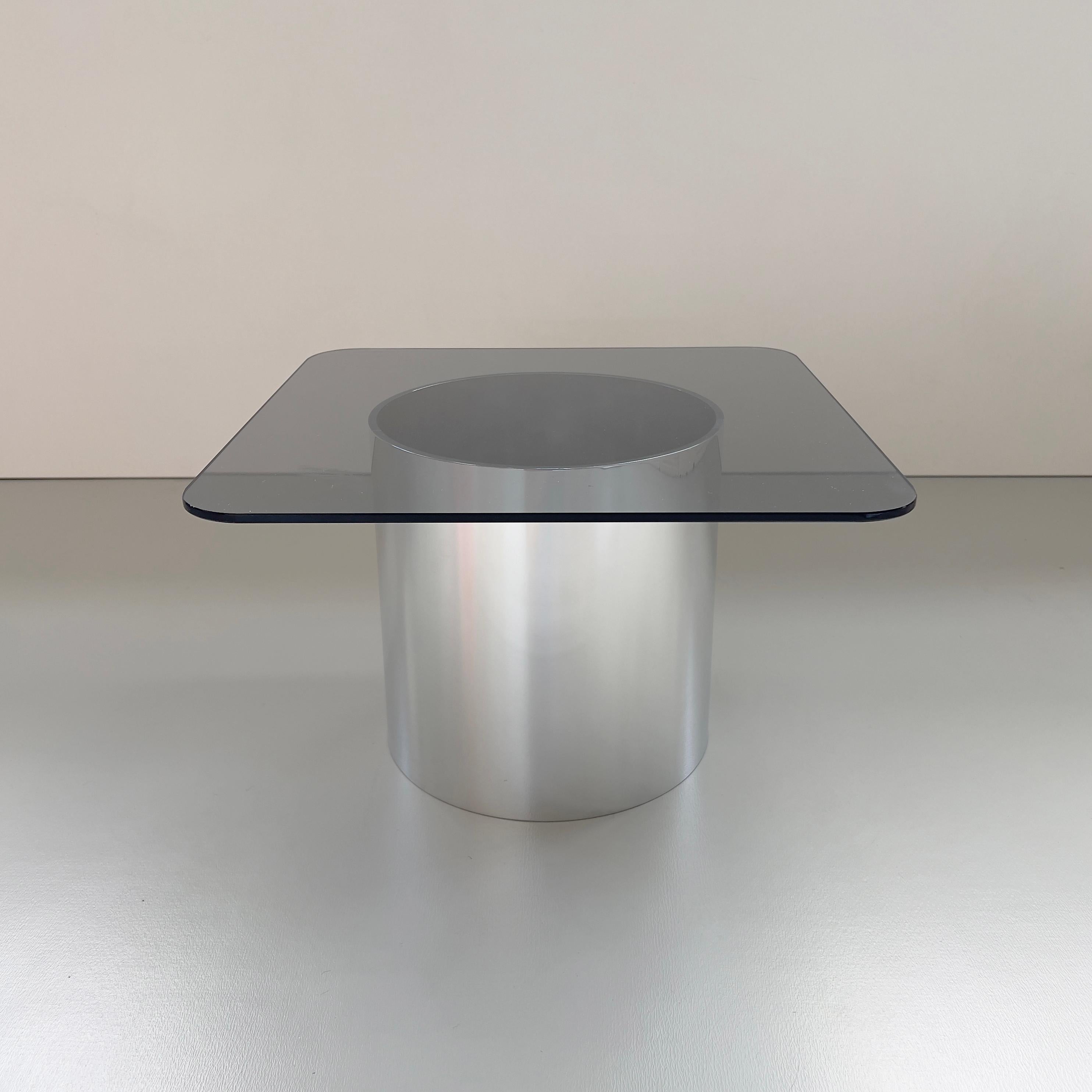 'MMPM' Tubular aluminium and grey tinted glass low side table.

This design further explores the designers obsession with tubular metal and graphical form. Still in his trademark minimal style, these tables are crafted in hand-polished aluminium