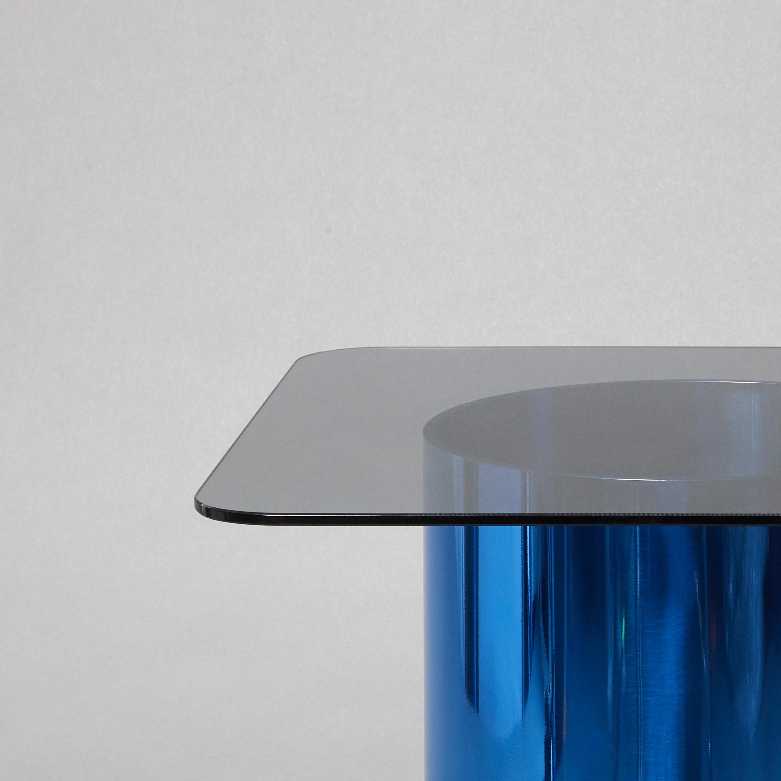This minimalist side table further explores the designer’s obsession with tubular metal and graphical form.

Still in his trademark minimal style, the table is crafted in large hand-polished blue tinted aluminium tubes (A specialist process