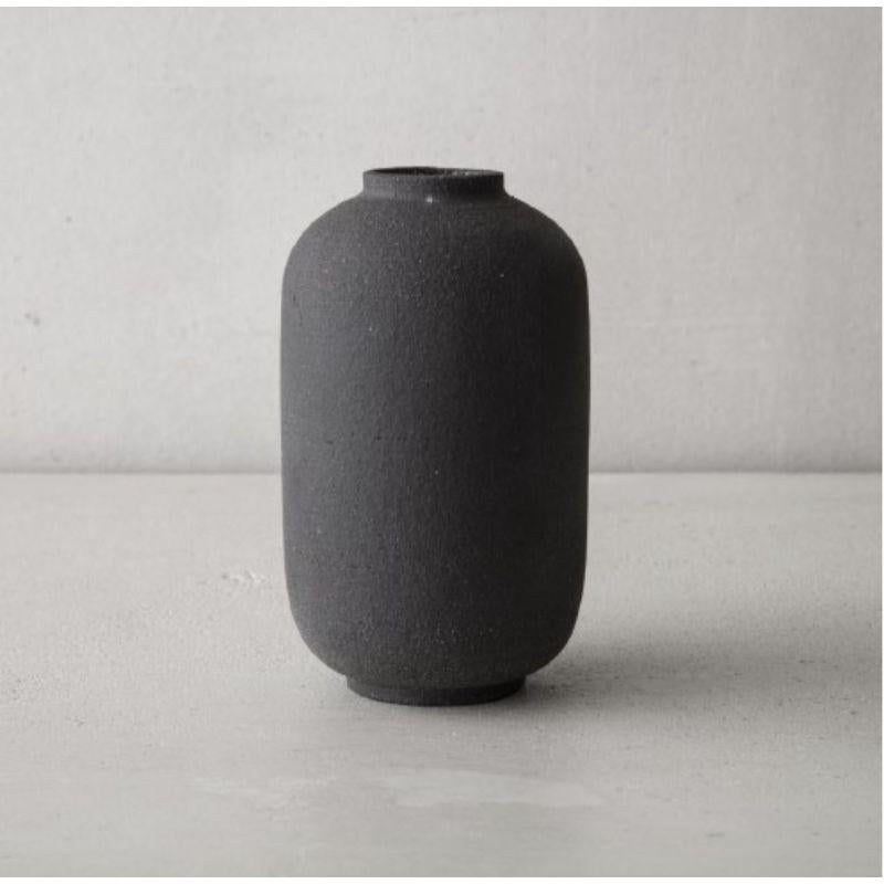 Mn L Medium Vase by Josefina Munoz
Mn LARGE collection
Dimensions: H27.5 x ?15 cm
Material: Ceramics (Black Sandstone and Transparent Enamel) 

Ceramic handcrafted vases, glazed inside. This pieces of pure and elegant personality are part of