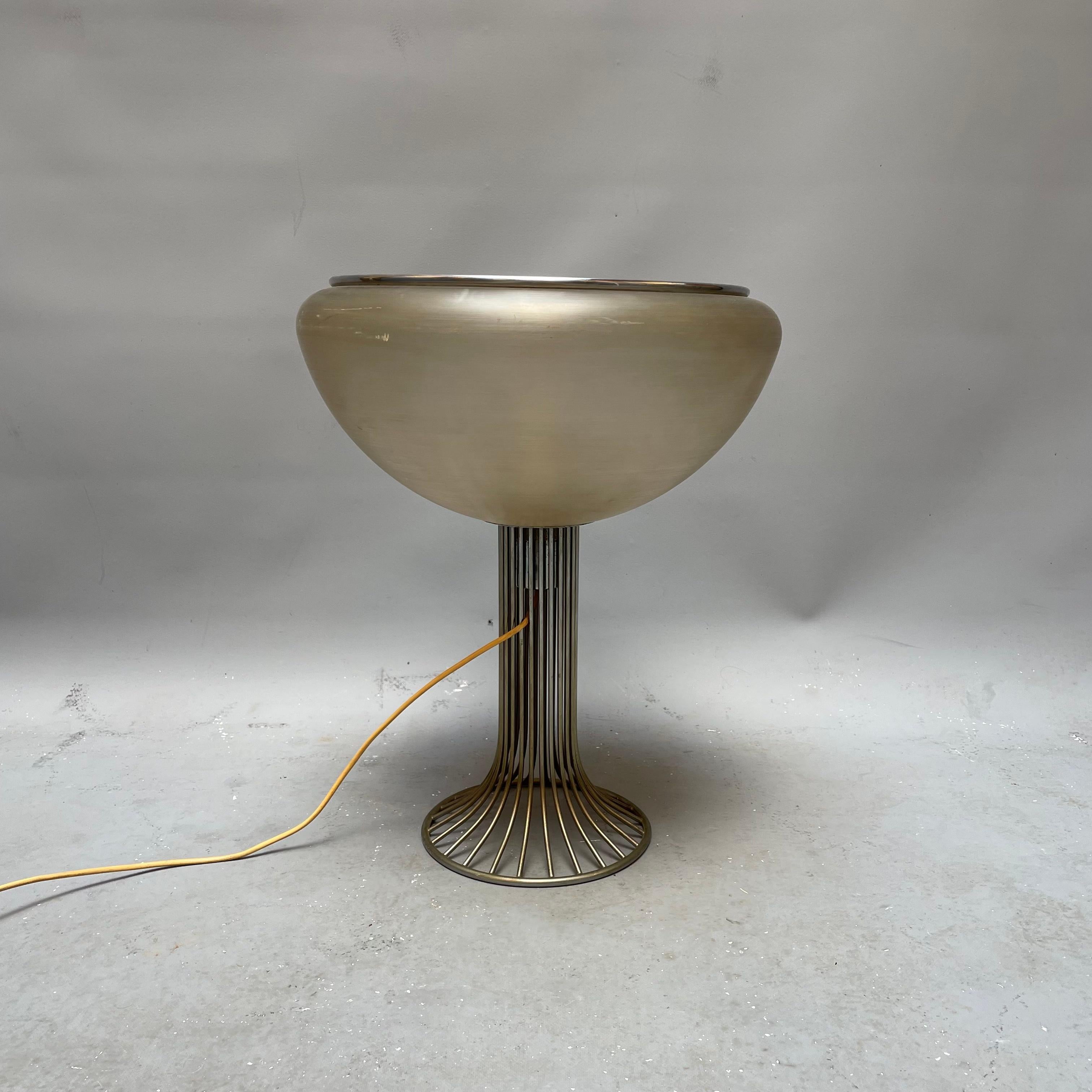 A lamp by Luigi Massoni, Italian designer born in Milan in 1930. Fundamental was the collaboration he began in 1962 with the Guzzini group, for which he not only designed numerous products (the Brumbry lamp, the Bolo Cubo bowls, 1962, and the
