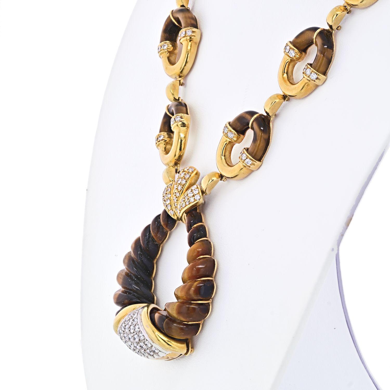 This Unusual Tribal Motif Tiger Eye and Diamond Link Necklace was created in 1970's and is made of pure 18k yellow gold. We love the high end look of this piece, that resembles oh so many New York and LA designers. However, since this item is not