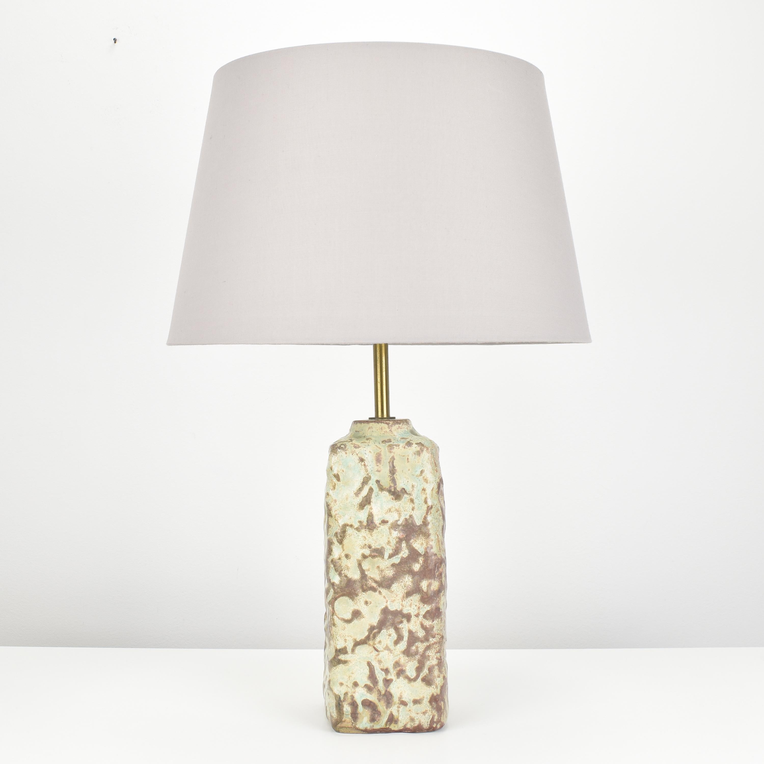 This Mobach ceramic table lamp is a vintage piece of studio pottery that features a textured surface, reminiscent of the Axel Salto style. 

The lamp's ceramic body measures approximately 9.5cm x 24.5cm x 9.5cm and is in perfect condition. 

The