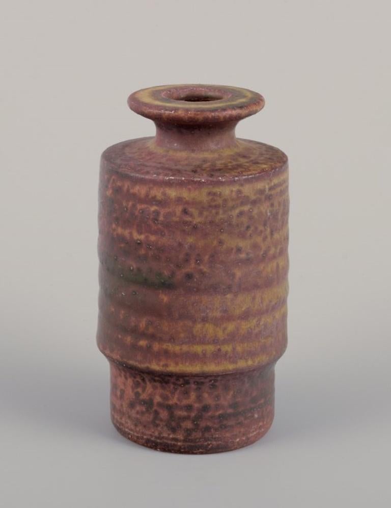 Mobach, Netherlands, three unique vases in glazed ceramic. 
Glaze in brown-green tones.
1960s/70s.
In perfect condition.
Signed.
Tallest: H 13.2 cm x D 6.5 cm.