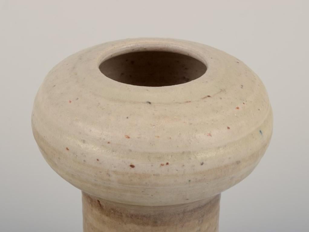 Modern Mobach, Netherlands. Two ceramic vases with glaze in light tones.