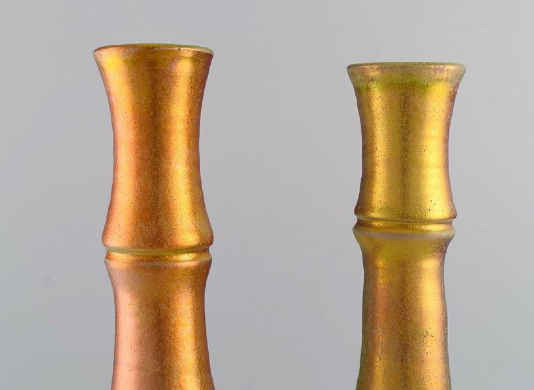 Mobach, Netherlands. 
Two unique slim vases in glazed ceramics. 
Beautiful eosin glaze. Mid-20th century.
Largest measures: 40 x 7.5 cm.
In excellent condition.
Stamped.