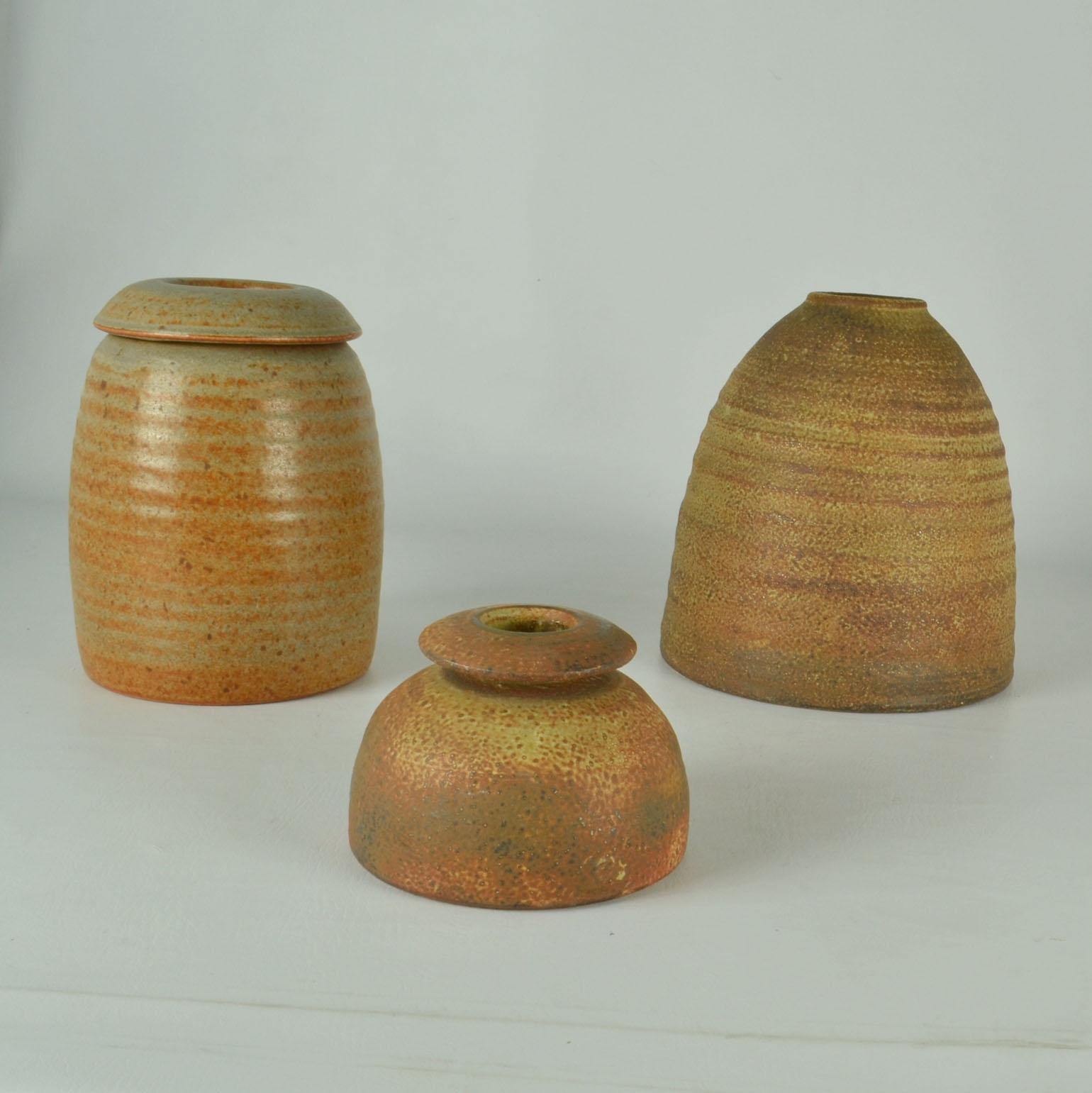 Sculptural beehive shape studio pottery vases group is created on the turning wheel by highly technical skilled Dutch ceramist Piet Knepper for Mobach in the 1960's. The glaze in tones of ocher, and rust browns are created by natural resources and