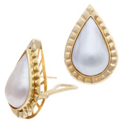 Mobe Pear Shape Pearl Earrings Framed in Ribbed 18k Gold with Omega