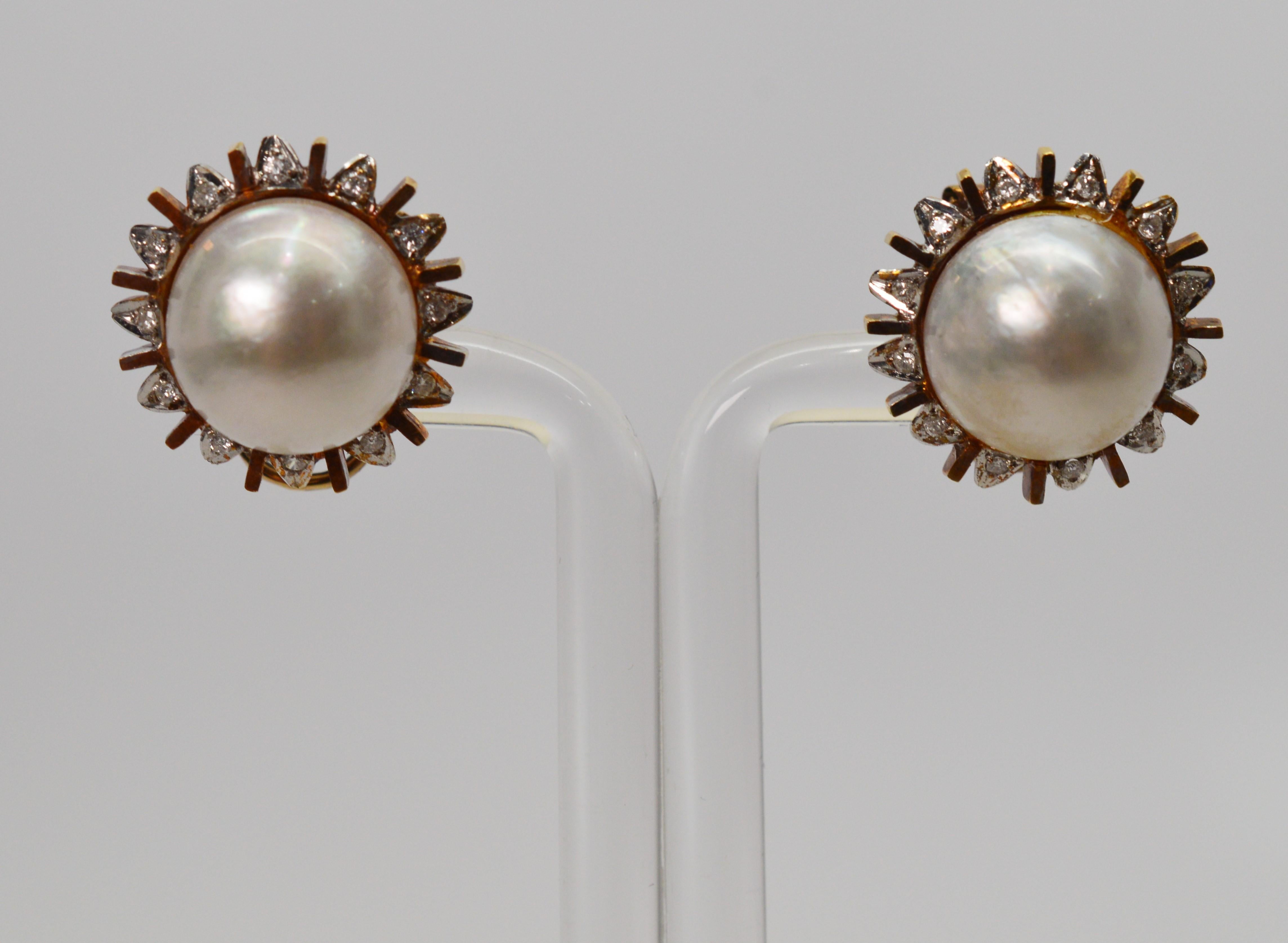 Rays of diamond and rose gold accent a sunny, naturally lustrous mobe pearl center on this attractive pair of pierced earrings. The mobe pearl measures 13 mm and the overall dimension is approximately 18.5 mm. These stud earrings are secured by a