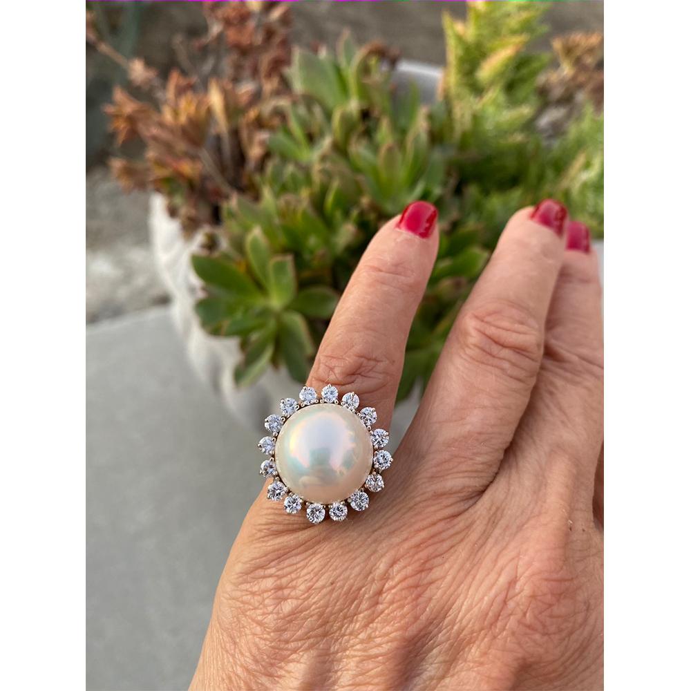 Mobee Pearl Ring expands 22 mm wide with beautiful diamonds on this quality Modern ring.
 Quality diamonds radiate from this ring as it moves. 

16 round brilliant cut diamonds are set around a sizeable mobee-shaped pearl measuring 15.70 mm
Diamonds