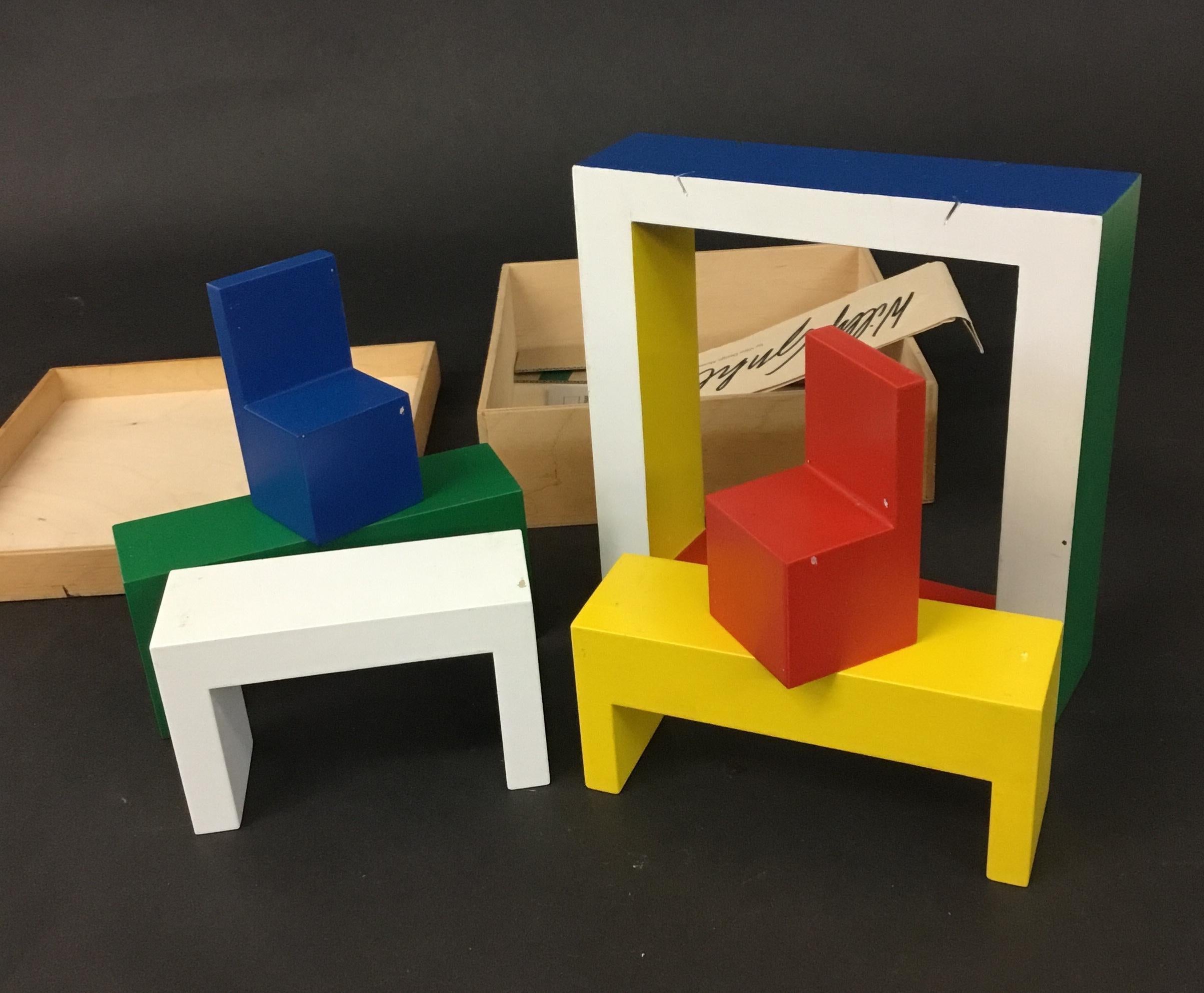 A toy designed by Willy Guhl in 1948, and re-released by Vitra Design Museum in 2000. A play furniture set and a puzzle in one. Complete with wooden box and paperwork.