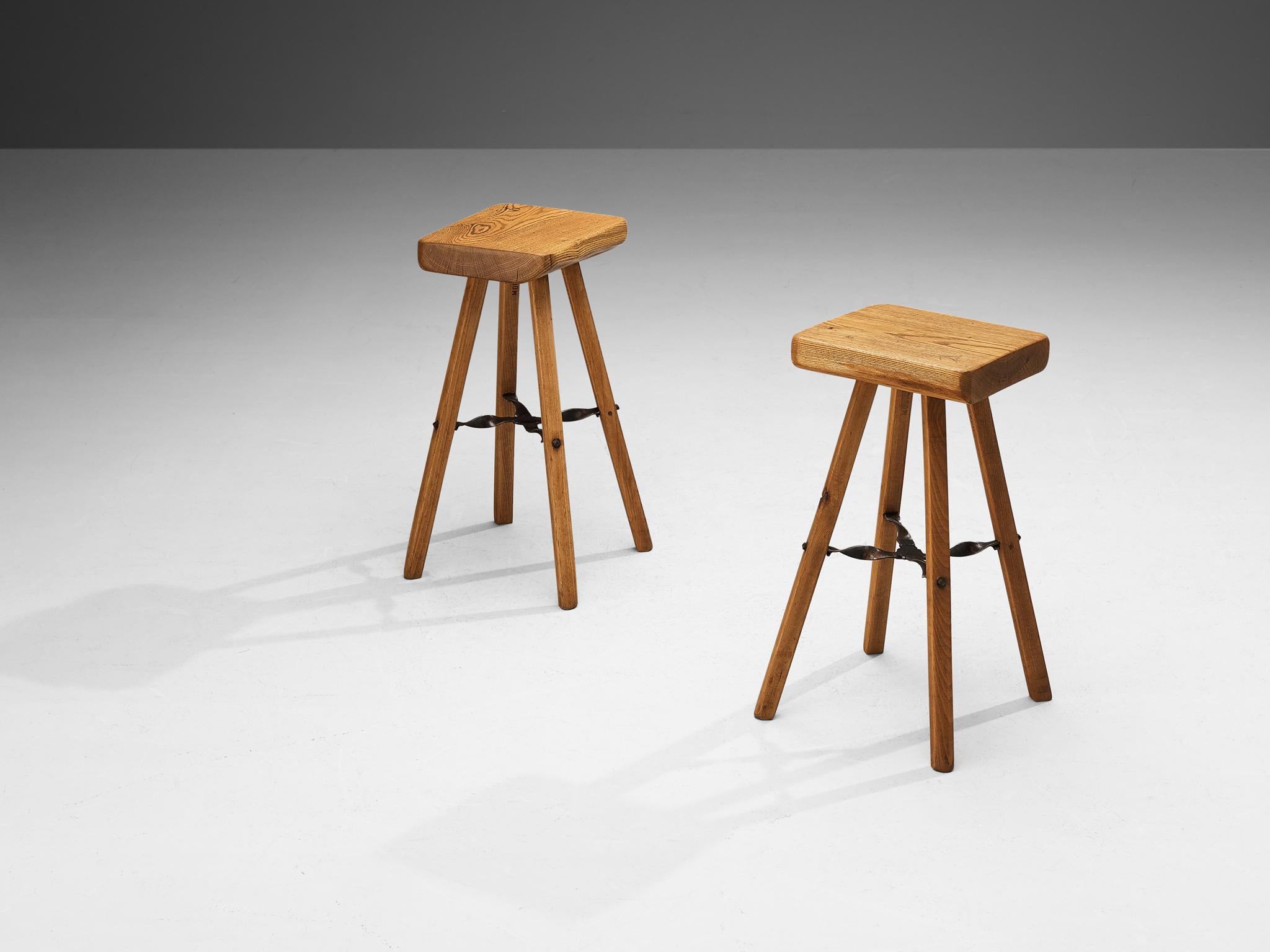 Mobichalet, bar stools, pine, Belgium, 1950s.

These high stools are produced by Mobichalet in the 1950s. The stools are all slightly different in form which gives them their rustic and naturalistic look. The chairs have a wrought iron cross between