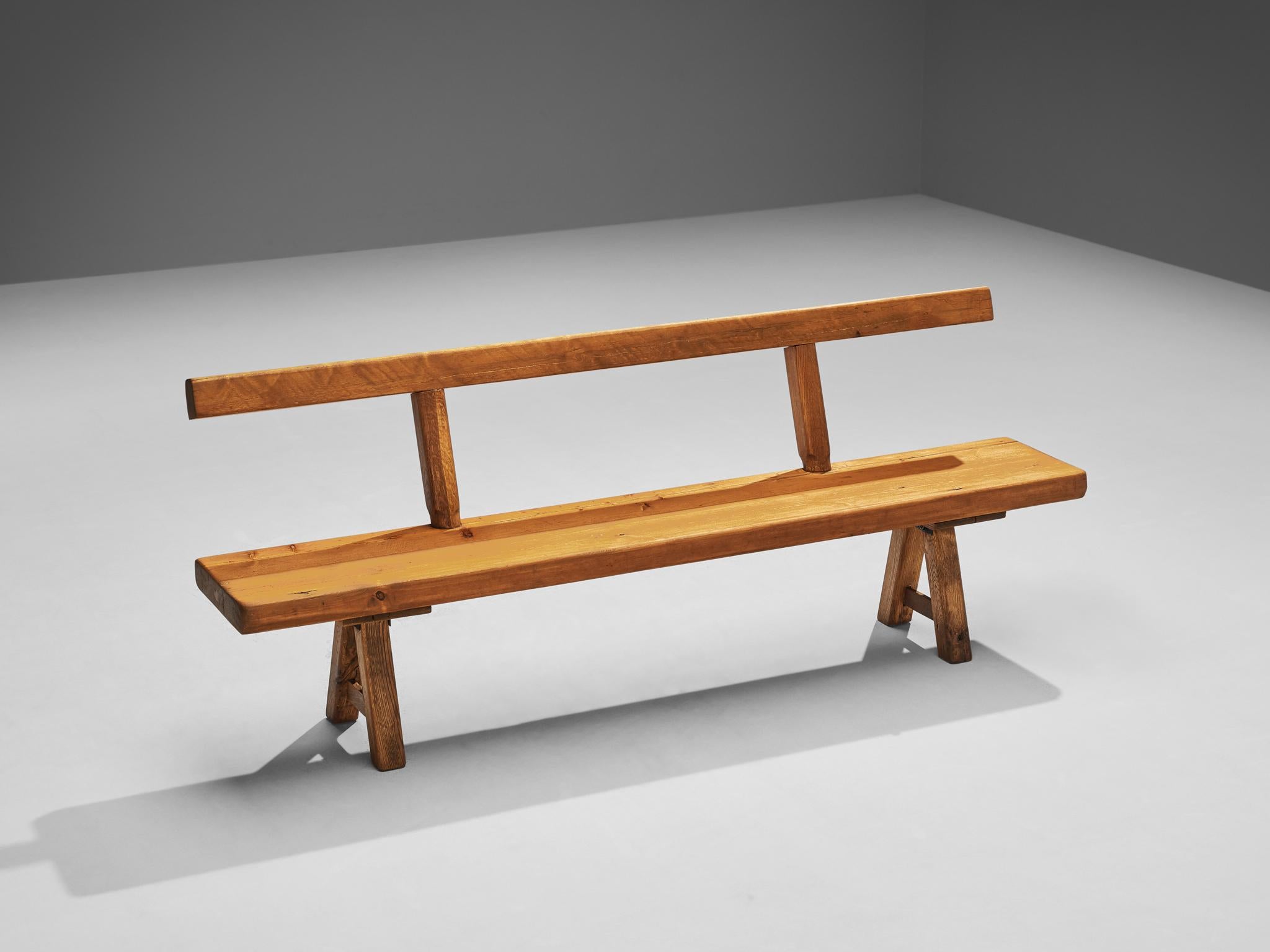 Mobichalet, long bench, oak, pine, Belgium, 1950s

This rustic bench will come forward nicely in a relaxing atmosphere, like a patio or a studio space. The brutalist appearance is expressed through robust forms and strong lines. The viewer can