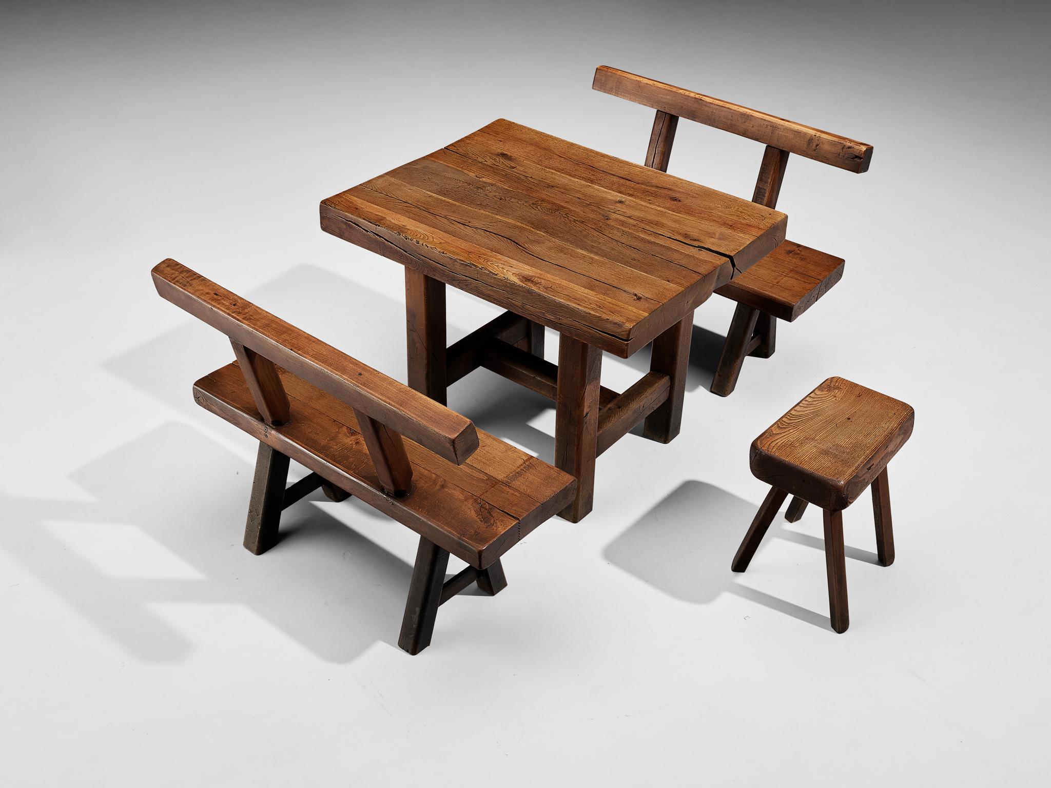 Mobichalet, set of dining table - pair of benches - stool, oak, beech, Belgium, 1950s

This rustic dining set will come forward nicely in a relaxing atmosphere, like a patio or a studio space. The brutalist appearance is expressed through robust
