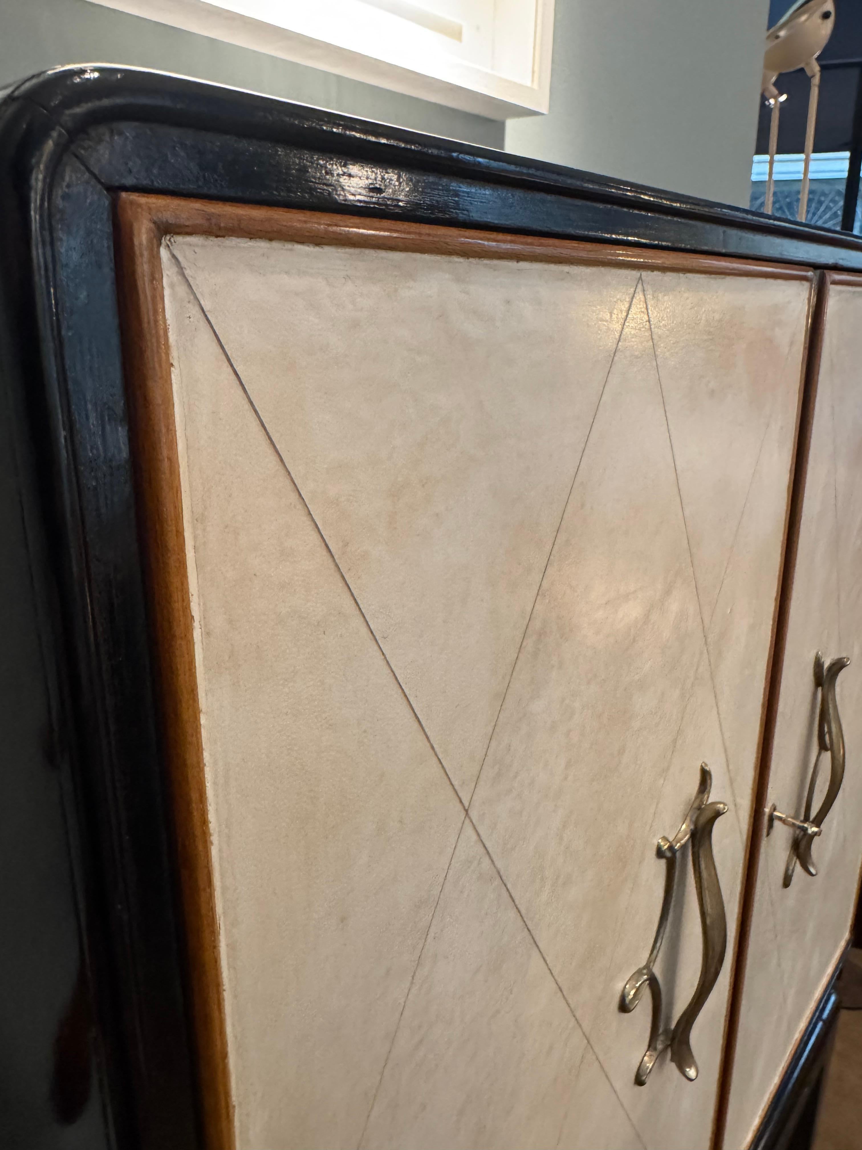 Brass Parchment and ebonized wood bar cabinet For Sale