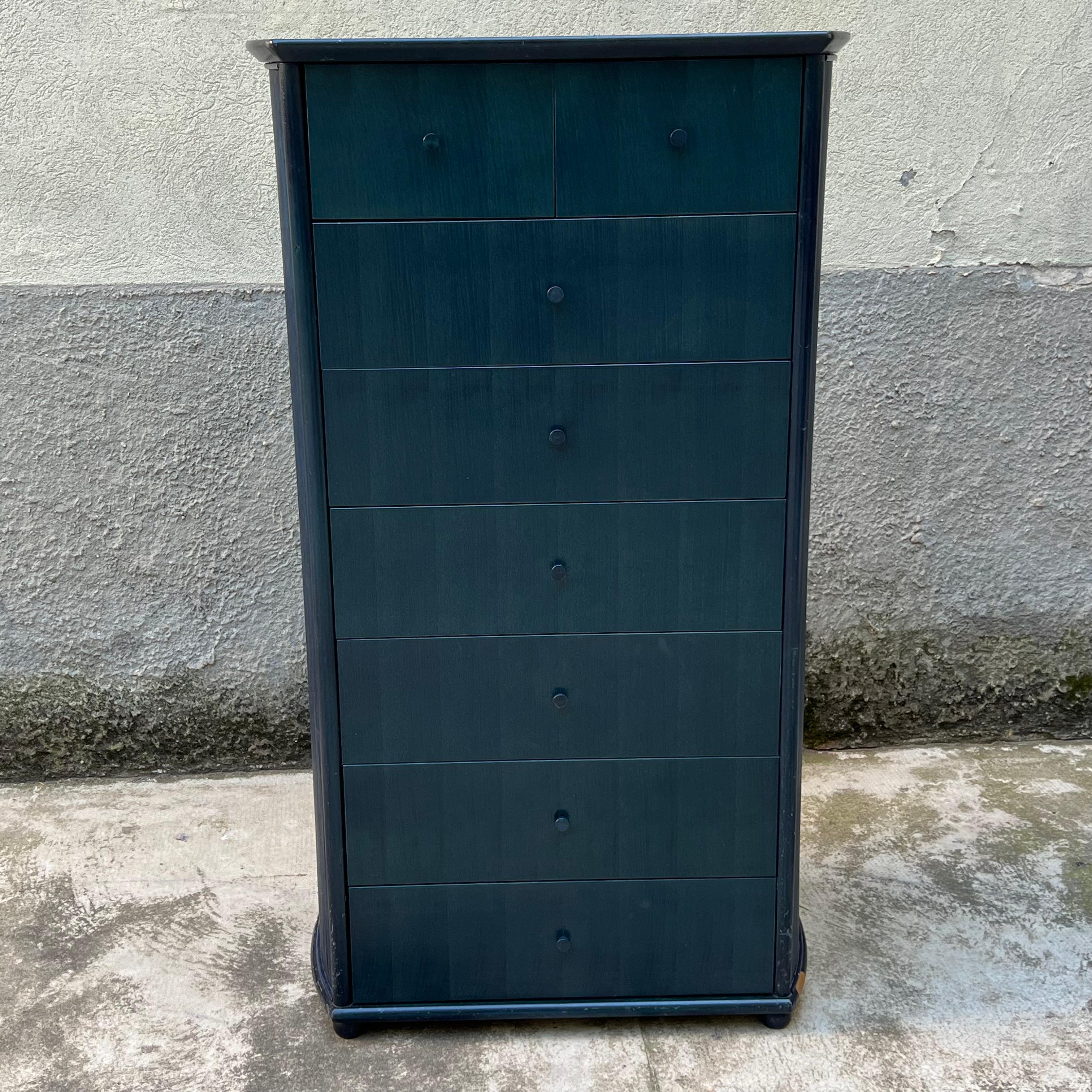 For sale is a fine vintage wooden chest of drawers designed in the 1980s by the prestigious Italian company Roberti Rattan. This cabinet features a sleek, linear design with 8 large drawers arranged vertically, ideal for those looking for a piece of
