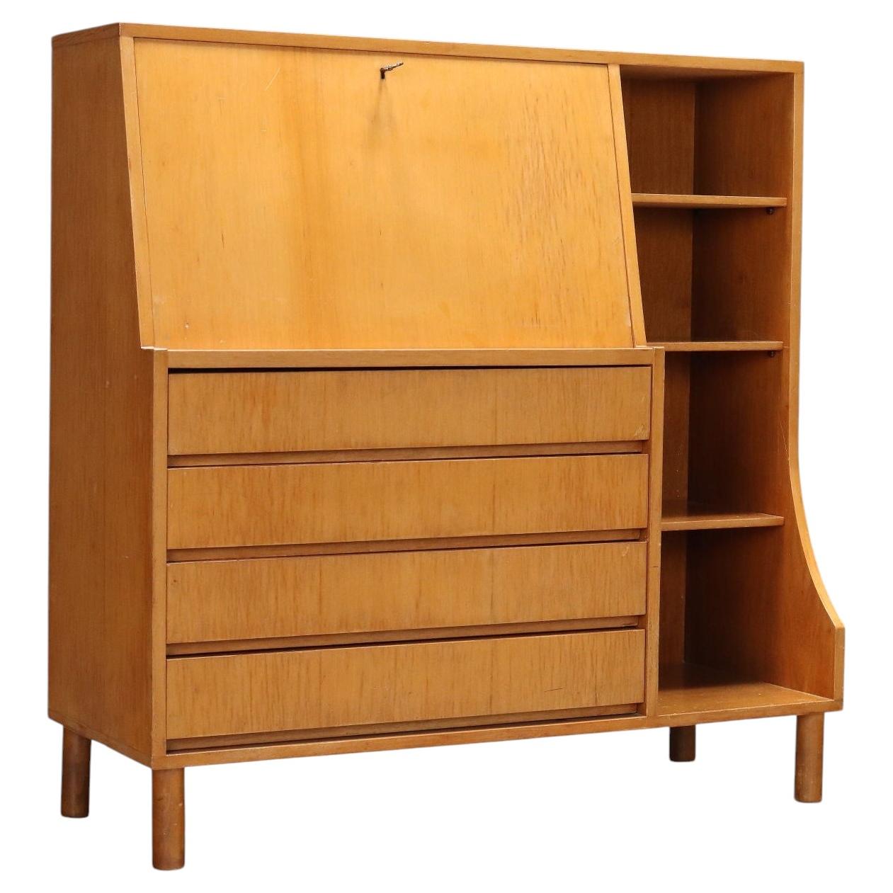 1960s maple storage cabinet with a drop-down door, made in Italy. For Sale