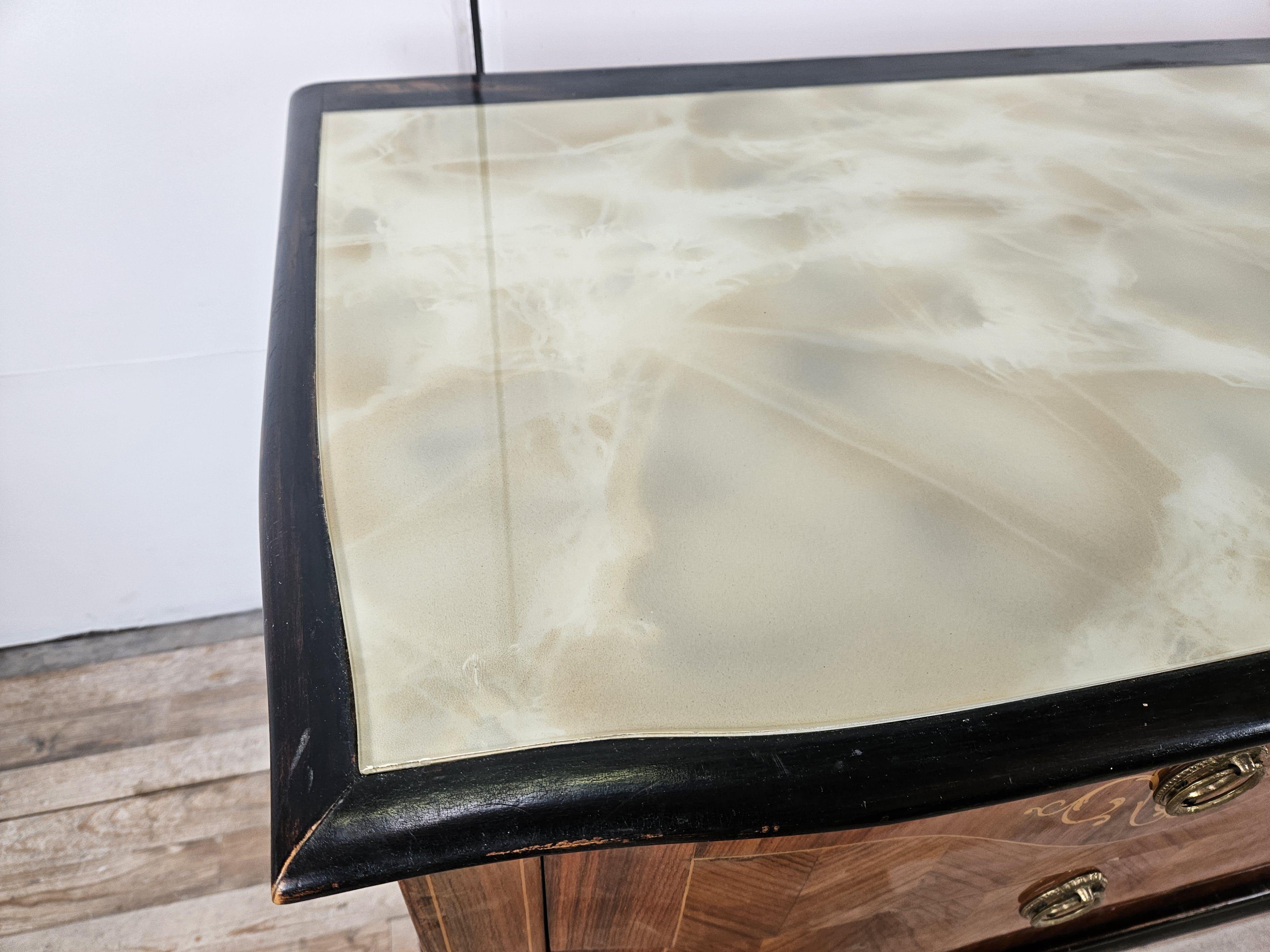 Italian Mid Century wood and brass bedroom cabinet with six drawers and glass top For Sale