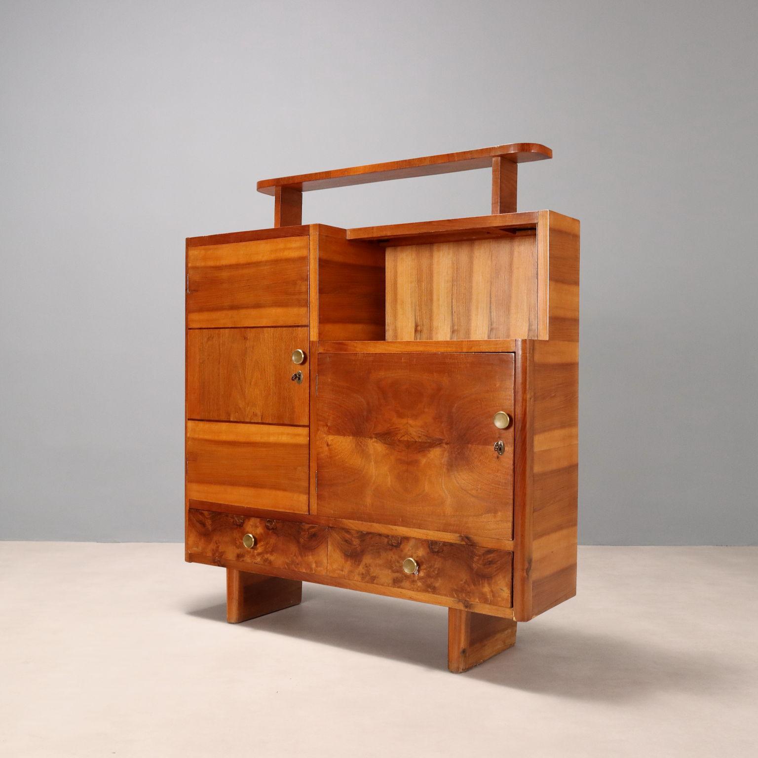 Vintage Deco-style furniture with open compartment, hinged doors concealing compartments with shelves, pair of drawers at the bottom. Brass handles, wooden frame with exotic wood veneer and walnut burl.