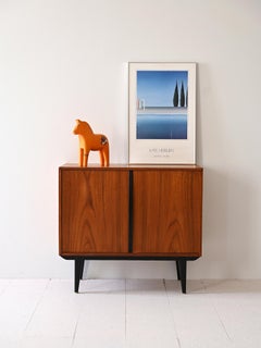 Mobile in teak con dettagli neri