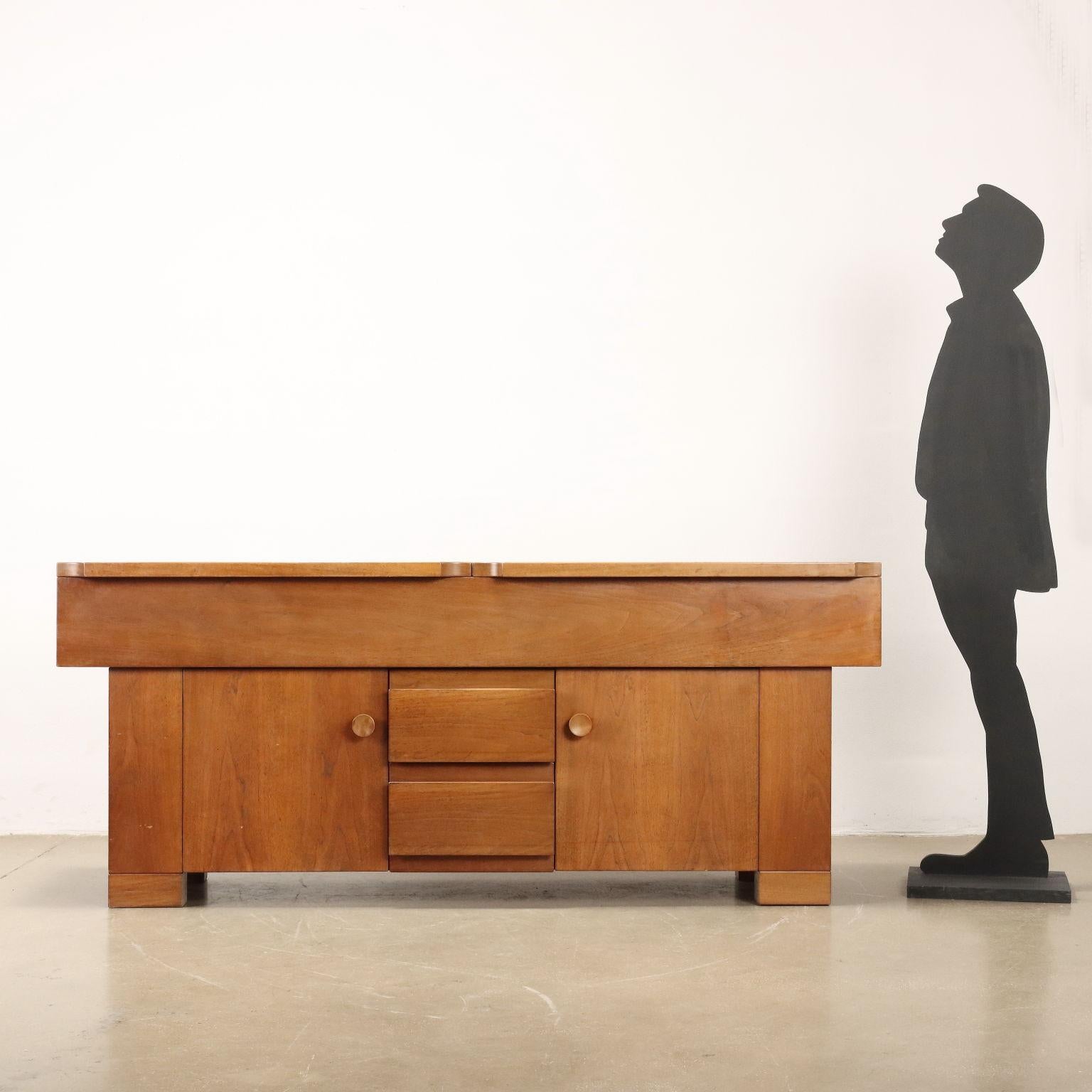 Sideboard cabinet with hinged doors and exposed drawers, designed by Michelucci in 1964; walnut veneer wood. Good conditions.