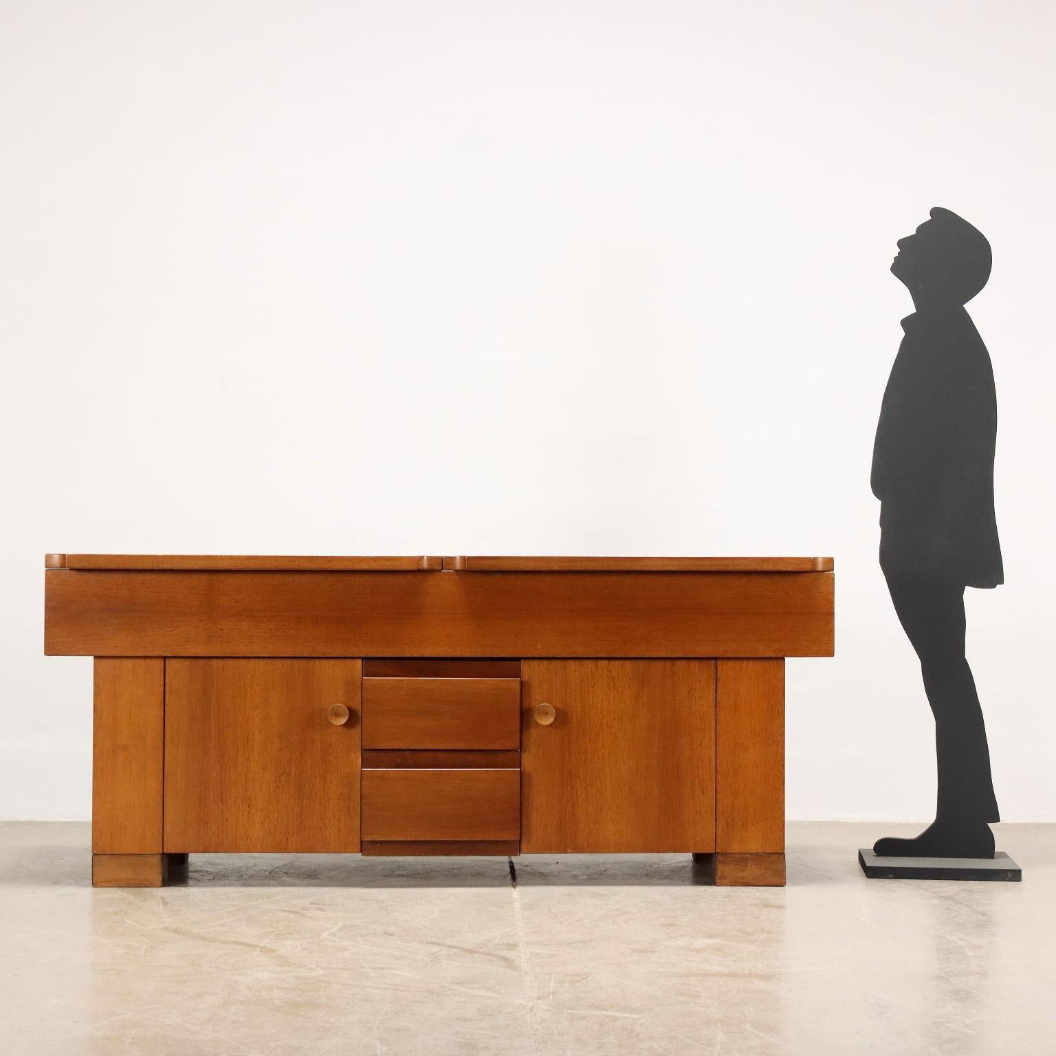 Sideboard with hinged doors and exposed drawers, designed by Michelucci in 1964; walnut veneered wood.