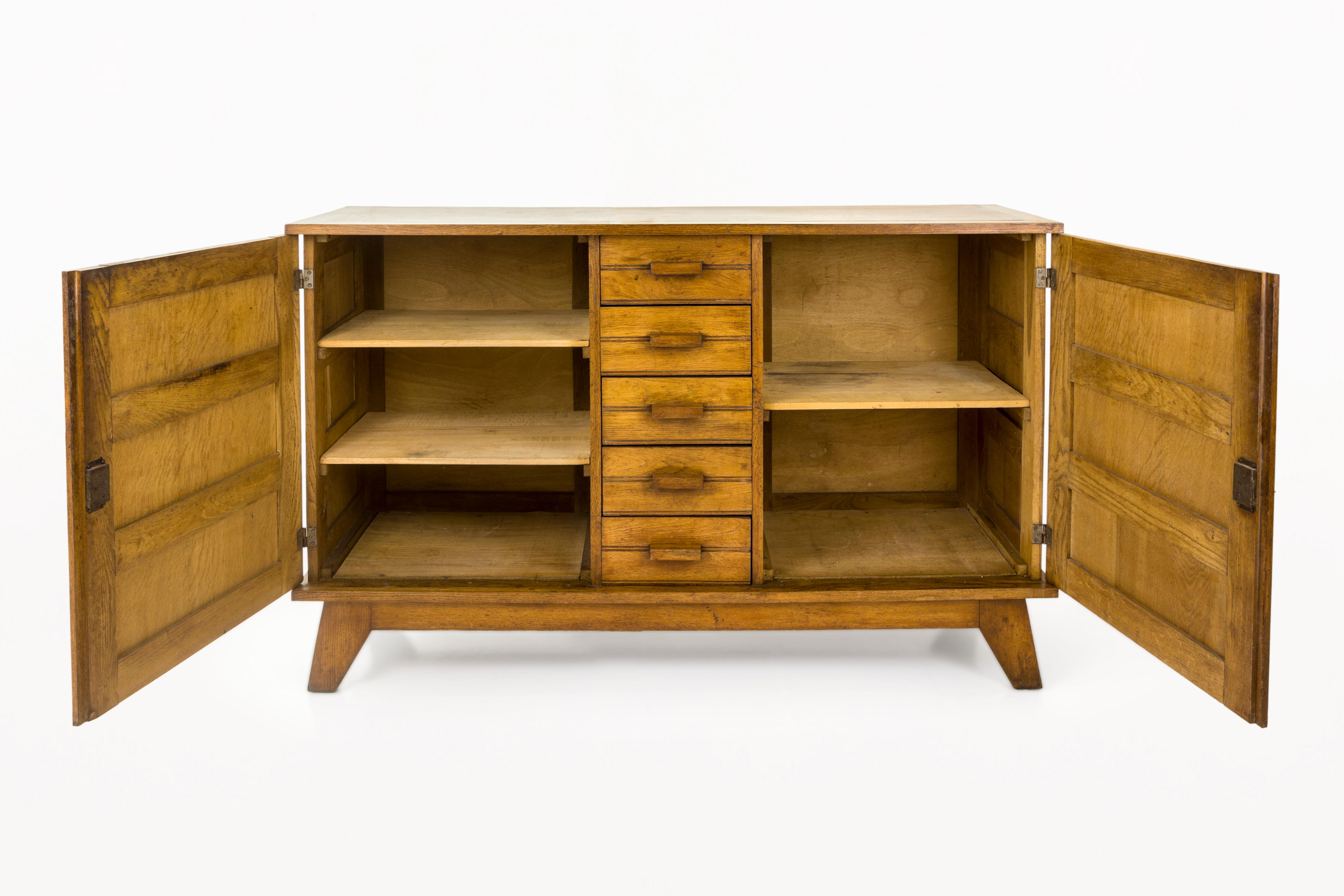 DESCRIPTION: Mobilier D’urgence Type v.150, Sideboard by Rene Gabriel, Circa 1950, France
Made of Oak
The 'Mobilier d'urgence type v.150' is a cabinet designed by French designer René Gabriel, part of a series of emergency furniture created as part