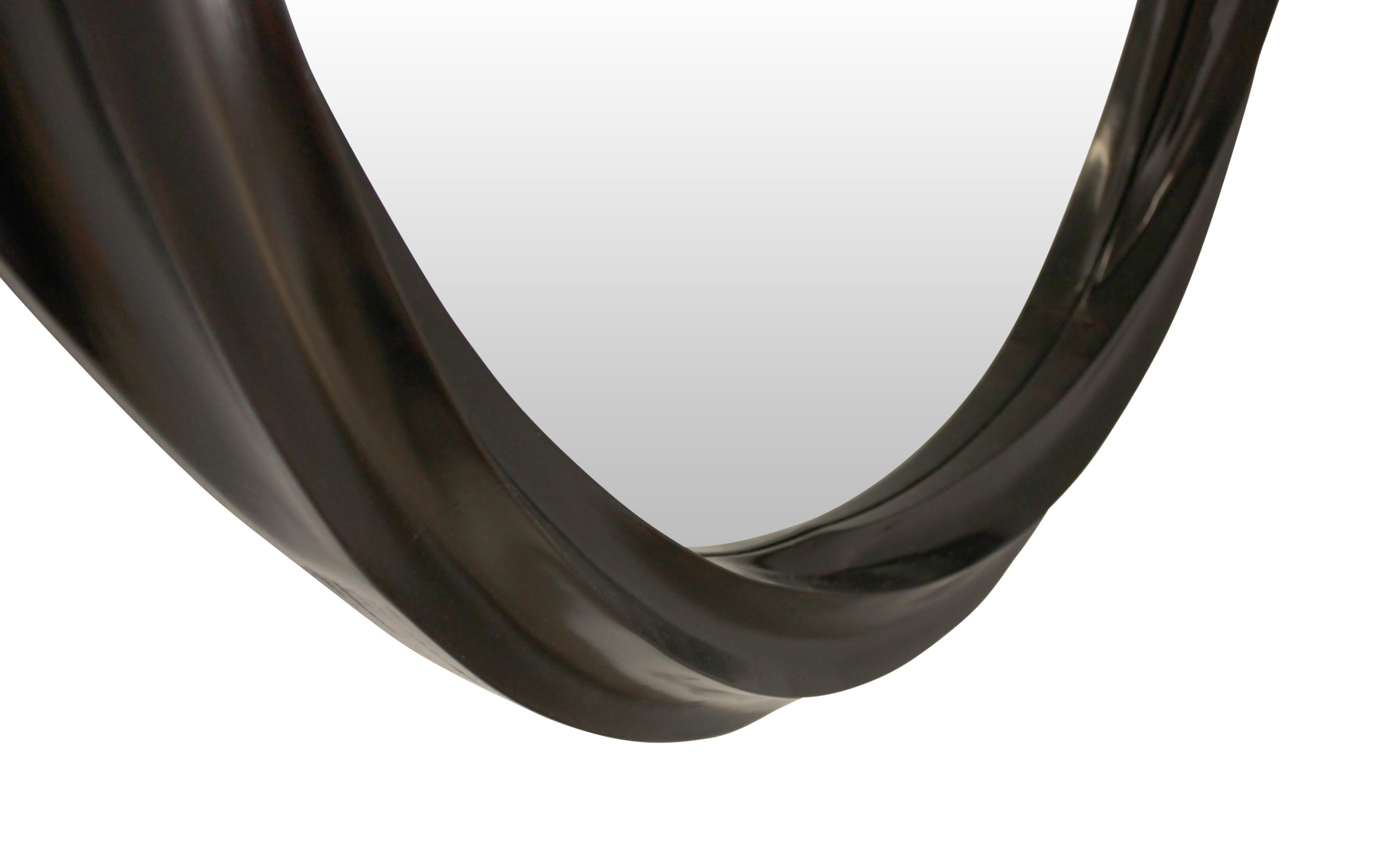 Wave series sculptural spiral wall mirror is presented with a sculptural colixoid frame consisting of 6 interpolated spiral concave surfaces, influenced by works of Moebius. Hard maple frame is stained and toned to a warm dark brown shade with satin