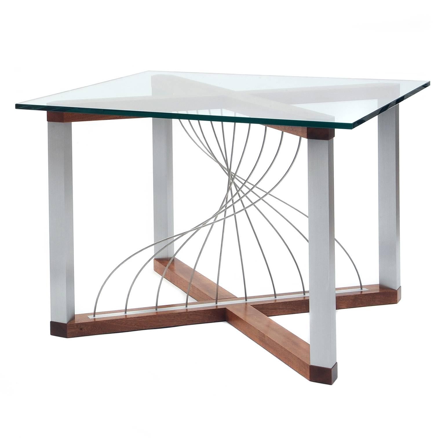 The Mobius end tables are a perfect balance between air and mass. It features stainless steel cables twisted into a beautiful Mobius-like curve. The cables flex to the touch yet naturally return to their position. The frame is constructed with two