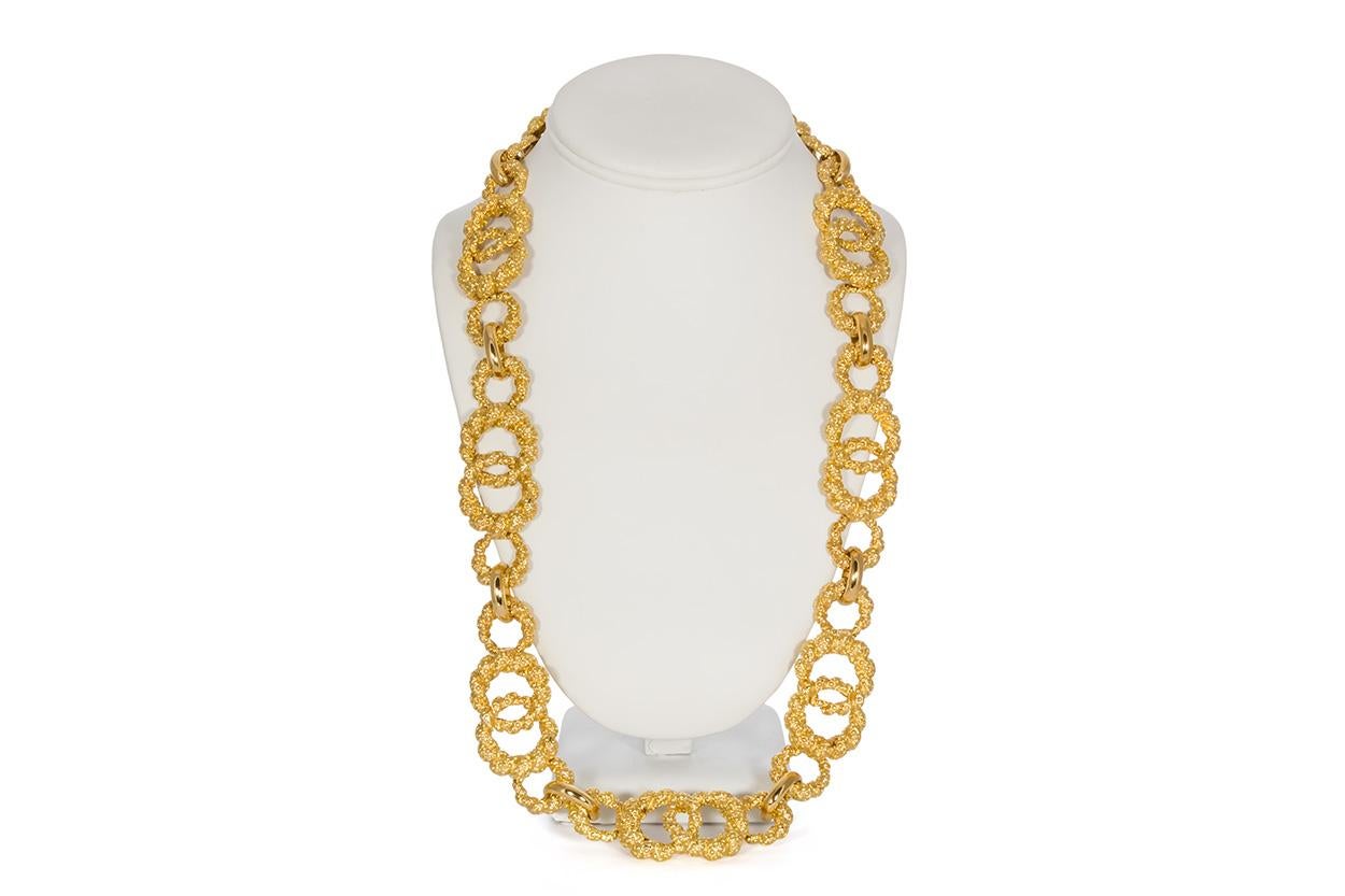 We are pleased to present this Ladies Moboco 18k Yellow Gold Vintage Necklace. This unique piece features a circular 18k yellow gold nugget design and measures 27.5 inches long. It is in very good condition and was recently polished by our master
