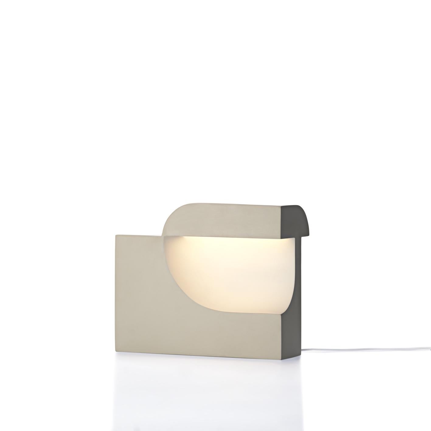 Moby 1 by Birgitte Due Madsen & Jonas Trampedach. 2015
Moby is an extraordinarily sculptural table lamp. Filled with intriguing contrasts, it balances a soft and comforting light with a striking, futuristic design. The void in the main element