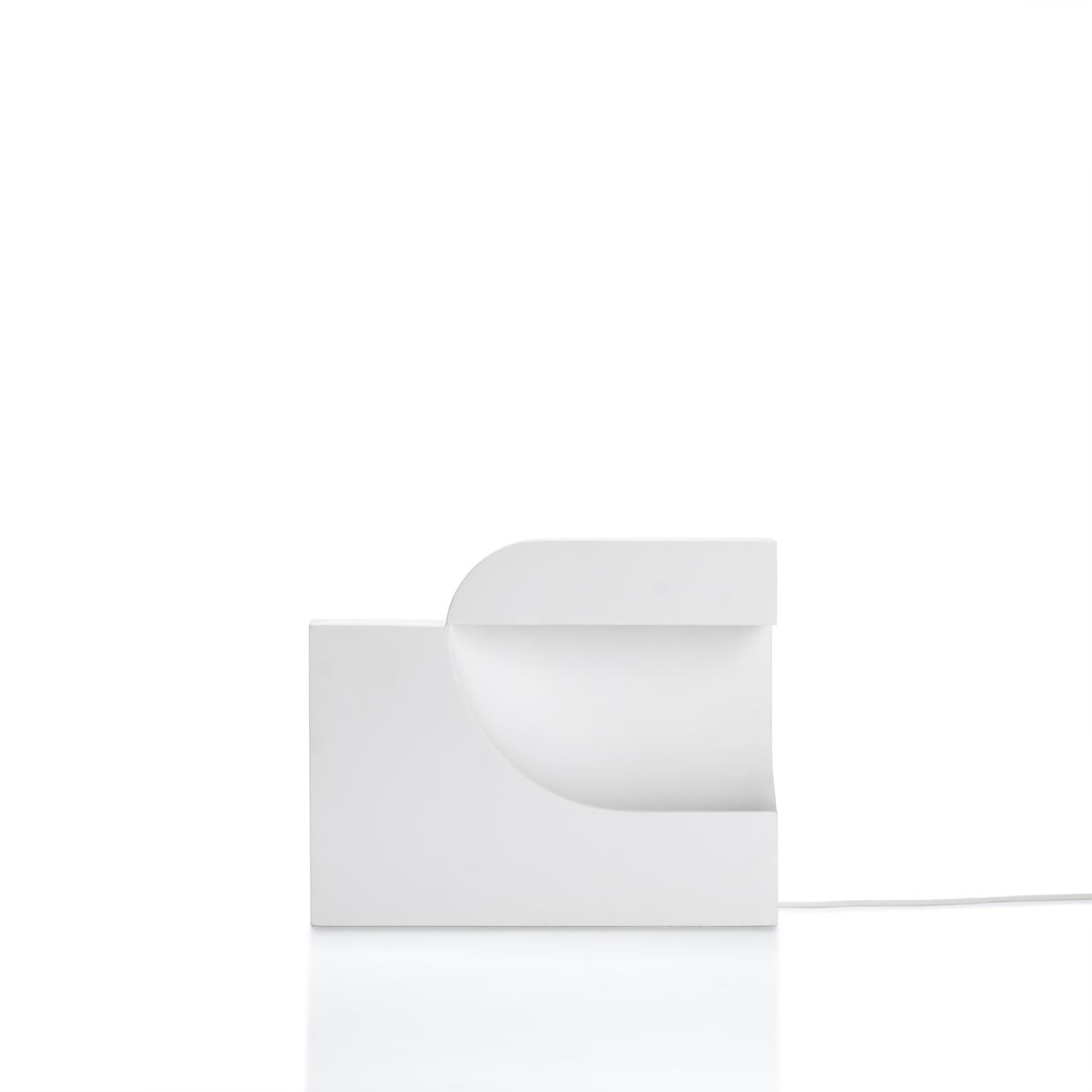 Moby 1 by Birgitte Due Madsen & Jonas Trampedach. 2015
Moby is an extraordinarily sculptural table lamp. Filled with intriguing contrasts, it balances a soft and comforting light with a striking, futuristic design. The void in the main element