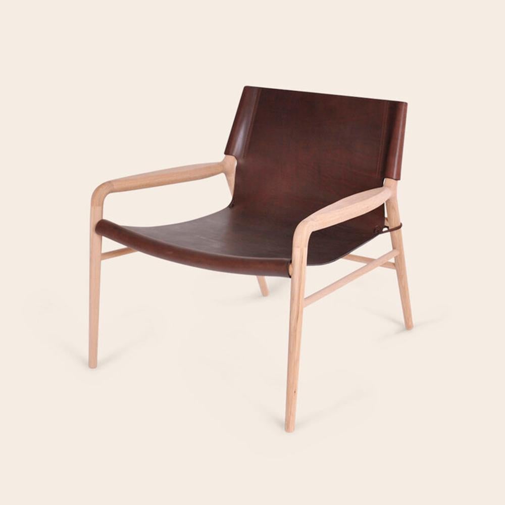 Mocca Rama oak chair by Ox Denmarq
Dimensions: D 72 x W 68 x H 70 cm
Materials: leather, wood
Also available: different colors available.

Ox Denmarq is a Danish design brand aspiring to make beautiful handmade furniture, accessories and