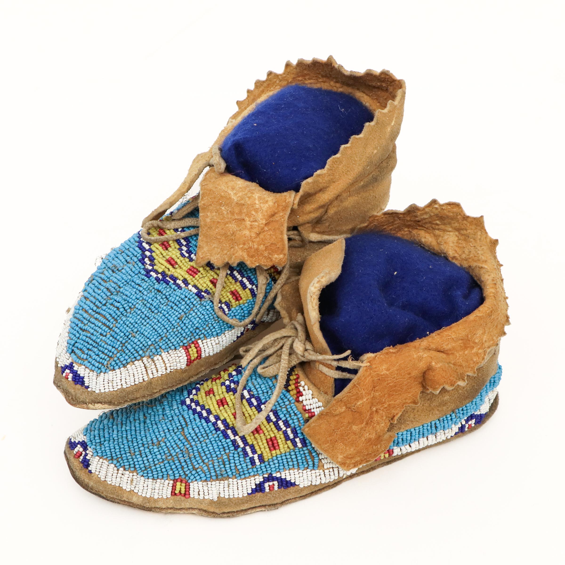 This exceptional pair of 19th-century Southern Cheyenne beaded moccasins, circa 1880, is a rare and authentic example of Plains Native American craftsmanship. Handcrafted from soft, native-tanned hide (likely deer or buffalo), these moccasins are