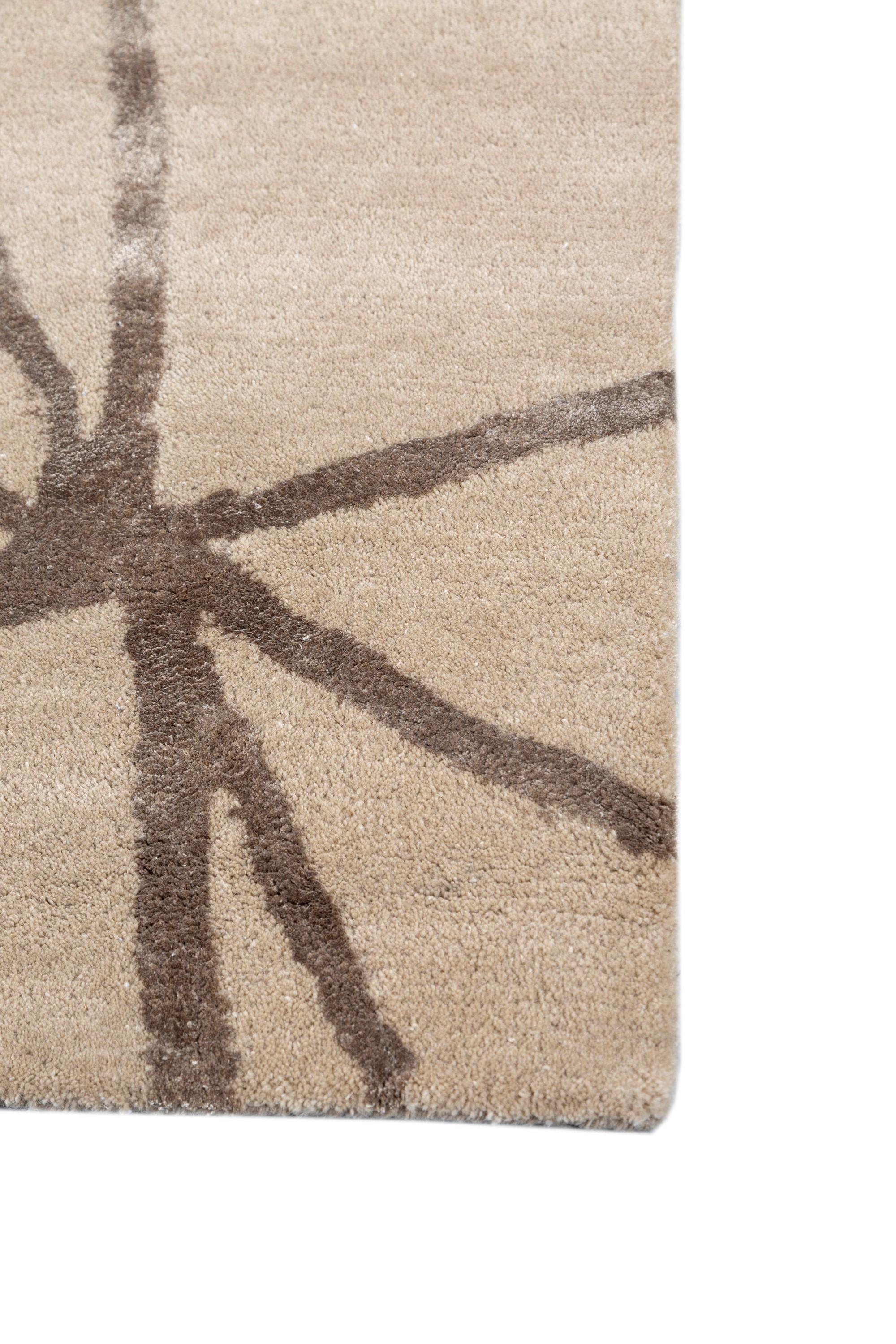 Introducing this designer rug from our Cascade collection, a masterpiece that seamlessly blends intricate patterns in a soothing palate. The complex design of this rug is a visual symphony, carefully woven to evoke a sense of calmness in any space