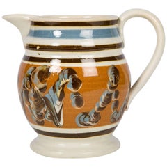 Antique Mocha Ware Pitcher Decorated with a Cable Pattern