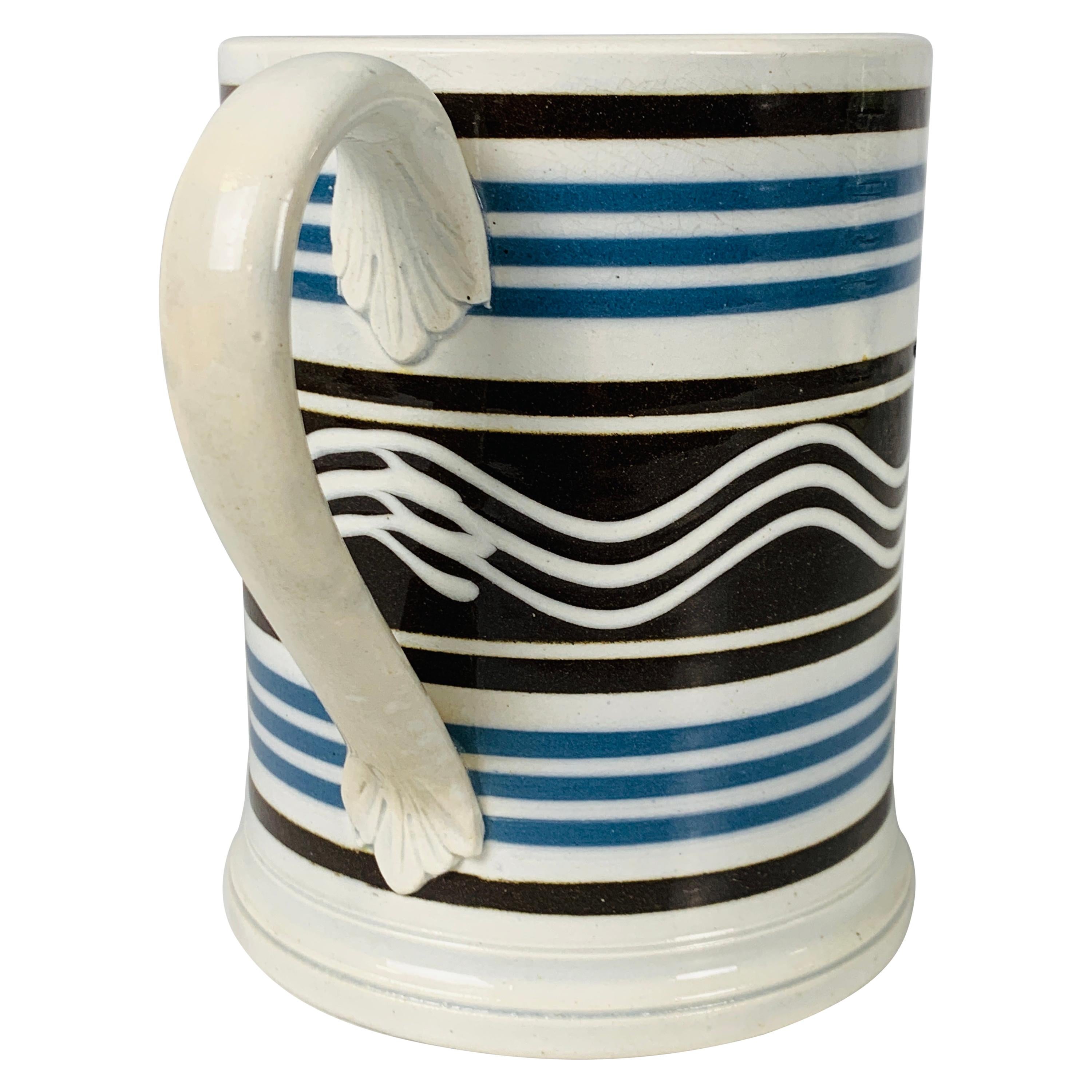 Mochaware Mug with White Trailed Slip in Wavy Lines 
Blue 
Black Stripes