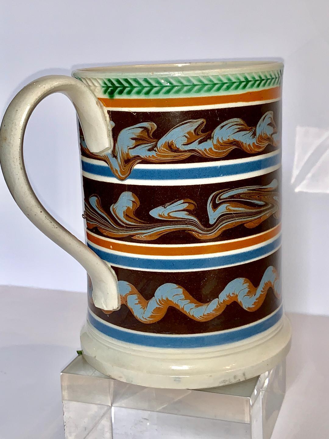 English Mochaware Quart Mug Decorated with Three Lines of Cable England, circa 1840