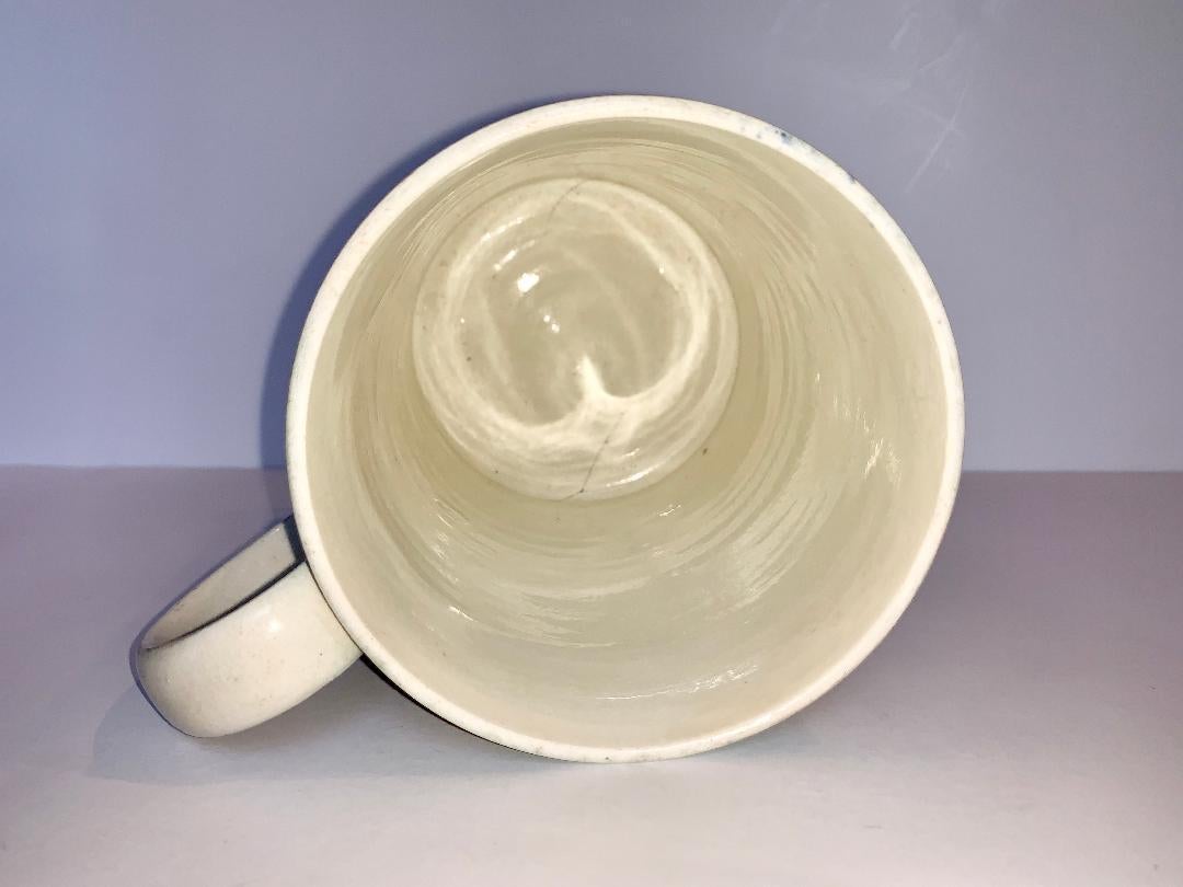 Earthenware Mochaware Quart Mug Decorated with Three Lines of Cable England, circa 1840