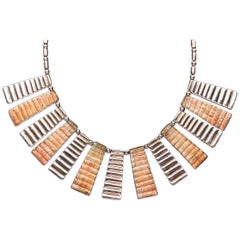 Coquillage Mochica Spondylus et pièces trapézoïdales en argent