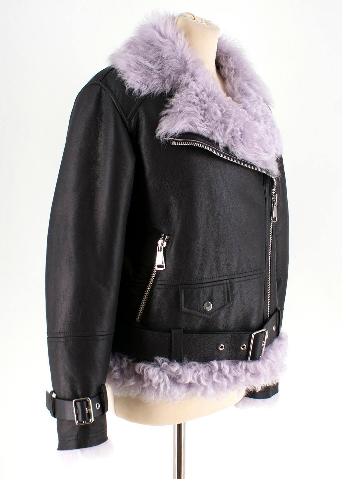 MO&Co Black Leather Jacket with Lilac Shearling Lining

Long sleeve black leather,
Biker jacket with purple fur interior,
Purple leather trim on the hem and a belt detail with a metal buckle,
Fastens in the front with a metal zip,
Belt detail with