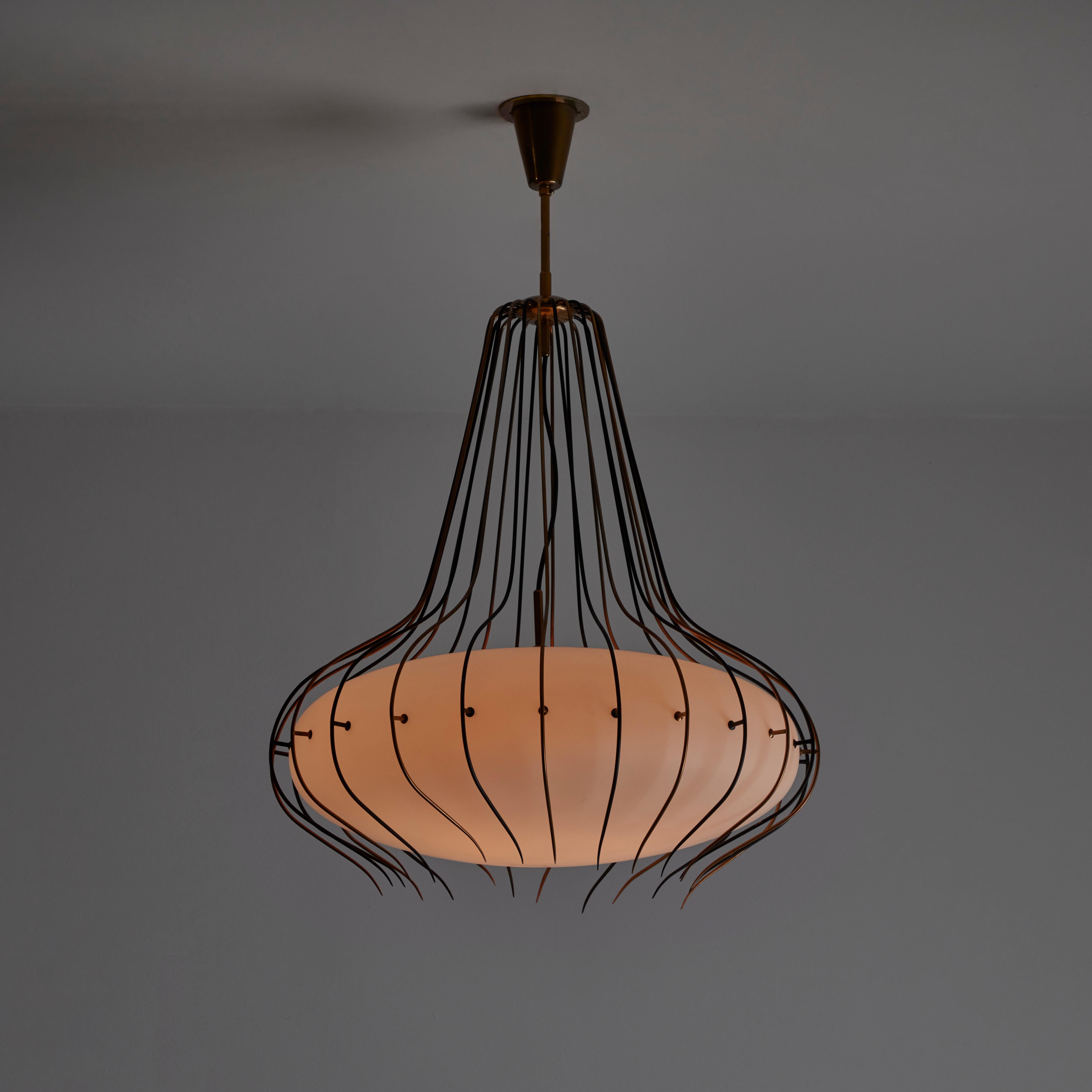 Angelo Lelii for Arredoluce 'Medusa' chandelier, model '12699'. Designed and manufactured in Italy, in 1958. Incredibly striking chandelier featuring a delicate and custom enameled brass frame that gently holds a stunning opaline glass shade. The