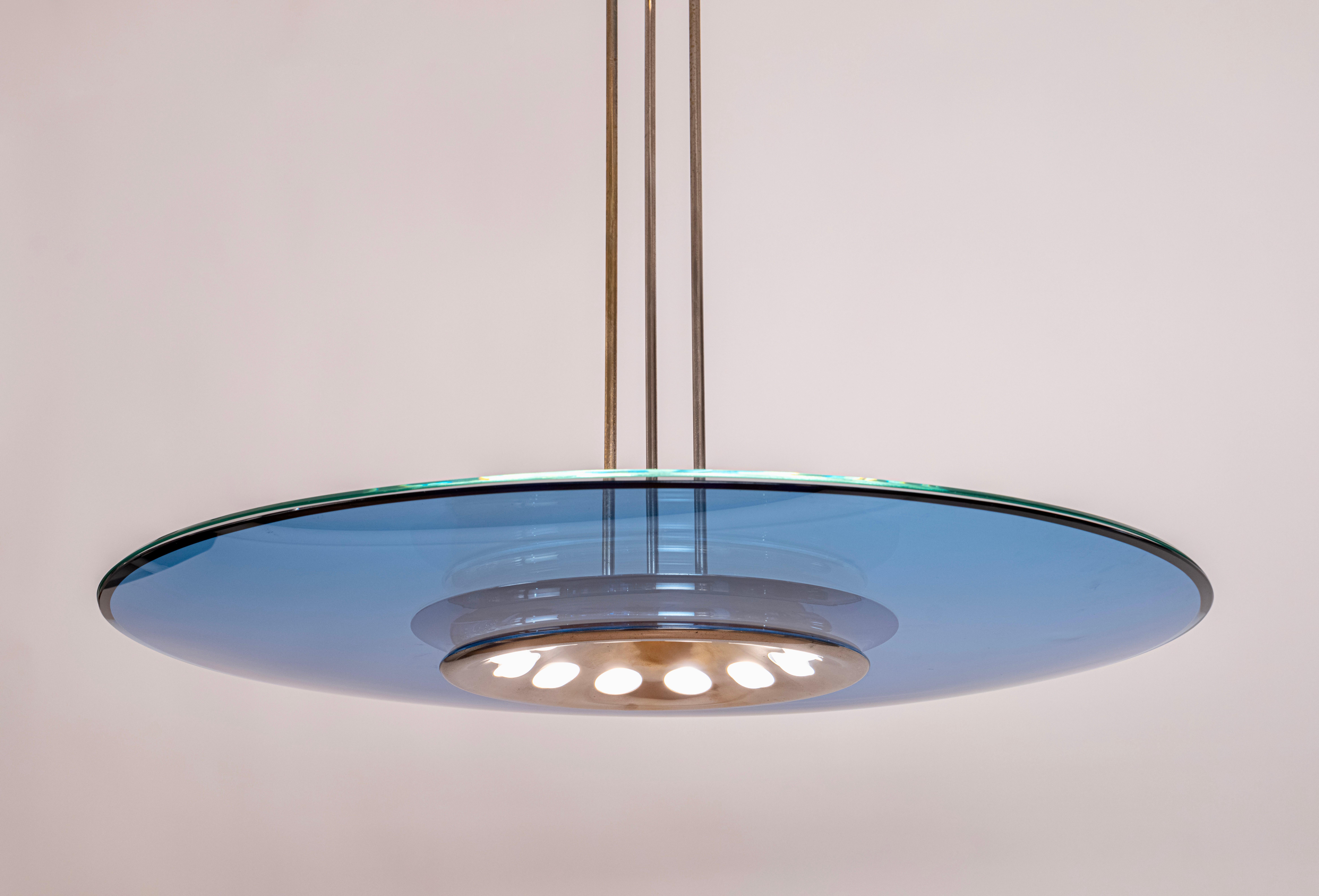An original and rare, blue glass and nickel-plated brass circular ceiling light designed by Max Ingrand for Fontana Arte, Italy. The model '1508' was first designed in 1954 and comprises of two pieces of glass, one concave and the other flat...these