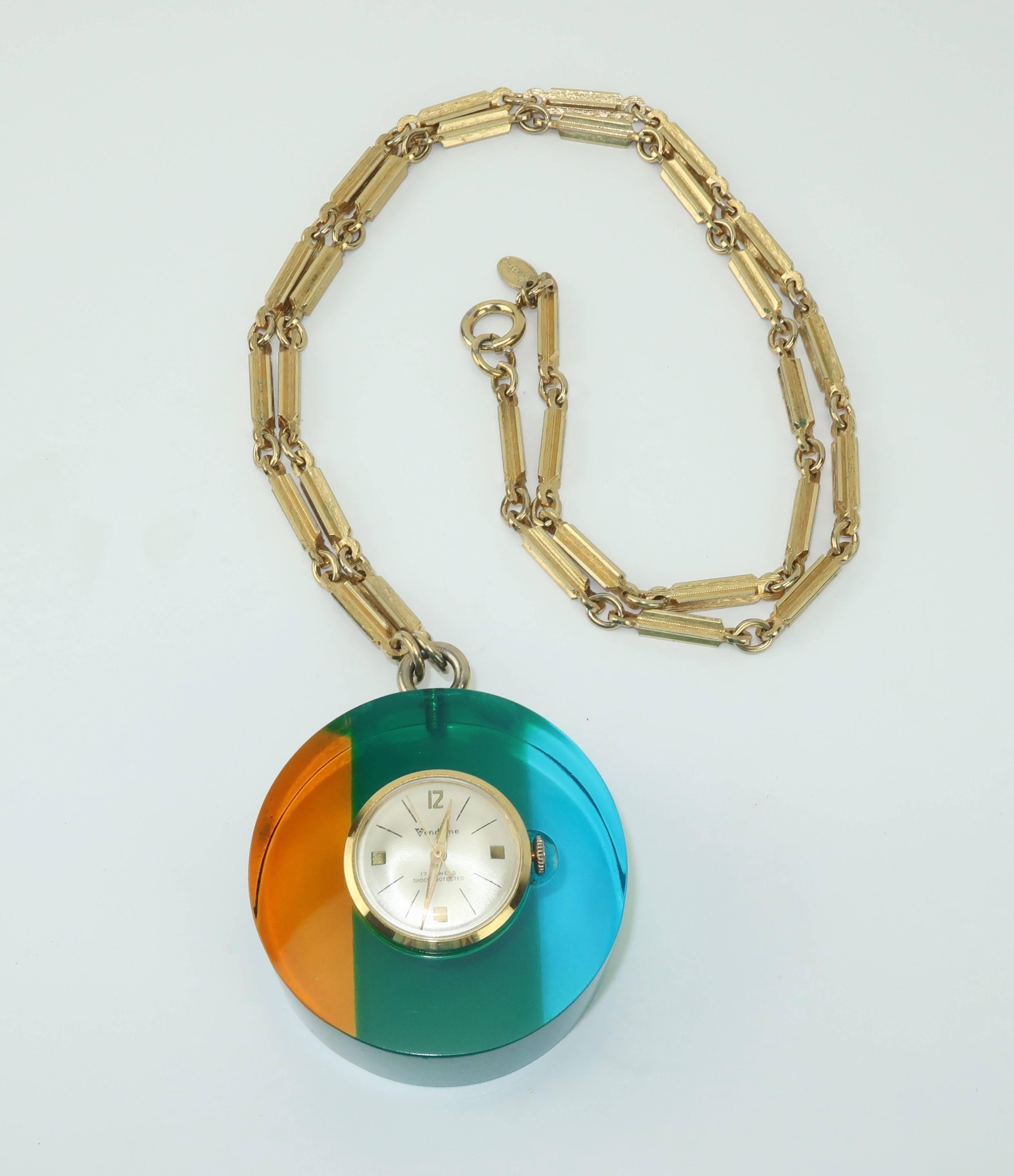 Time is on your side!  This mod 1960's lucite pendant watch by Vendome, the high end mark for the Coro jewelry family, magically glows with shades of translucent yellow, green and blue.  The style and quality of the lucite case design is reminiscent