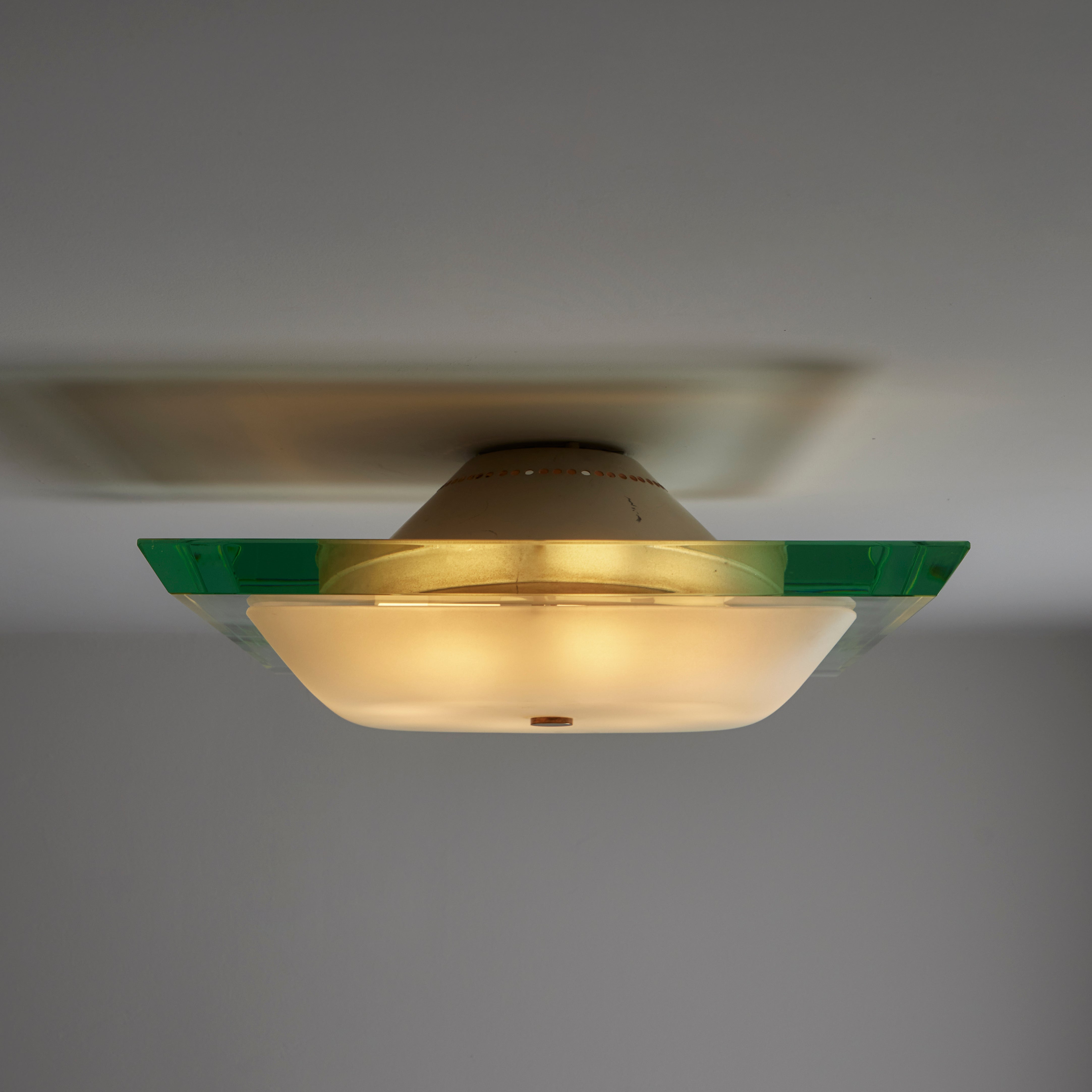 Mod. 1990 flush mount by Max Ingrand for Fontana Arte. Designed and manufactured in Italy circa the 1960s. Iconic and recognized teal blue thick cut and beveled cut glass from Fontana Arte makes this simple, striking ceiling light. A bottom frosted