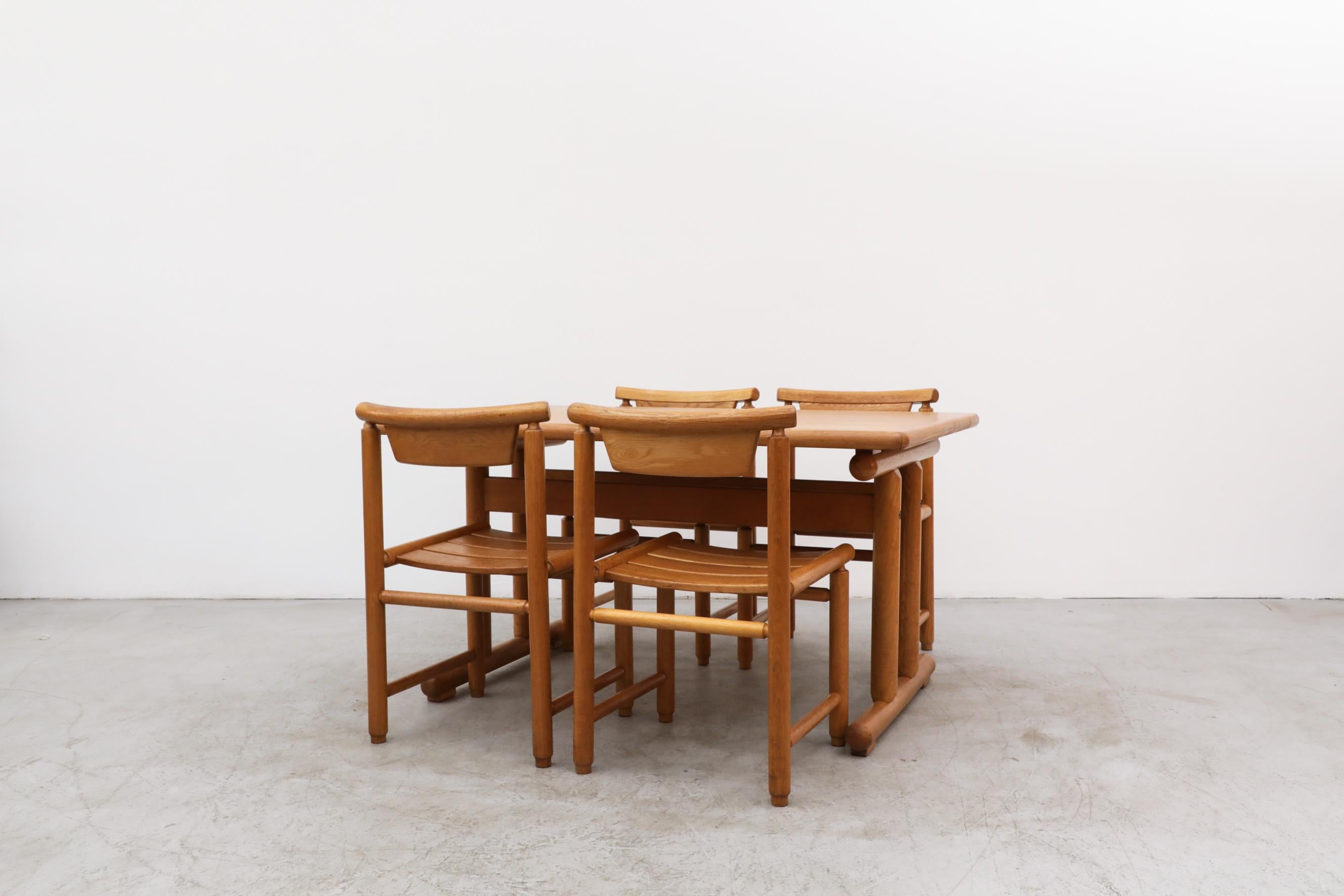 Ettore Sottsass meets Vico Magistretti in this MOD 70's designed oak dining set. Oak trestle table with soft edges and 4 matching side chairs. Lightly refinished set, in otherwise original condition. Wear is consistent with their age and use. The