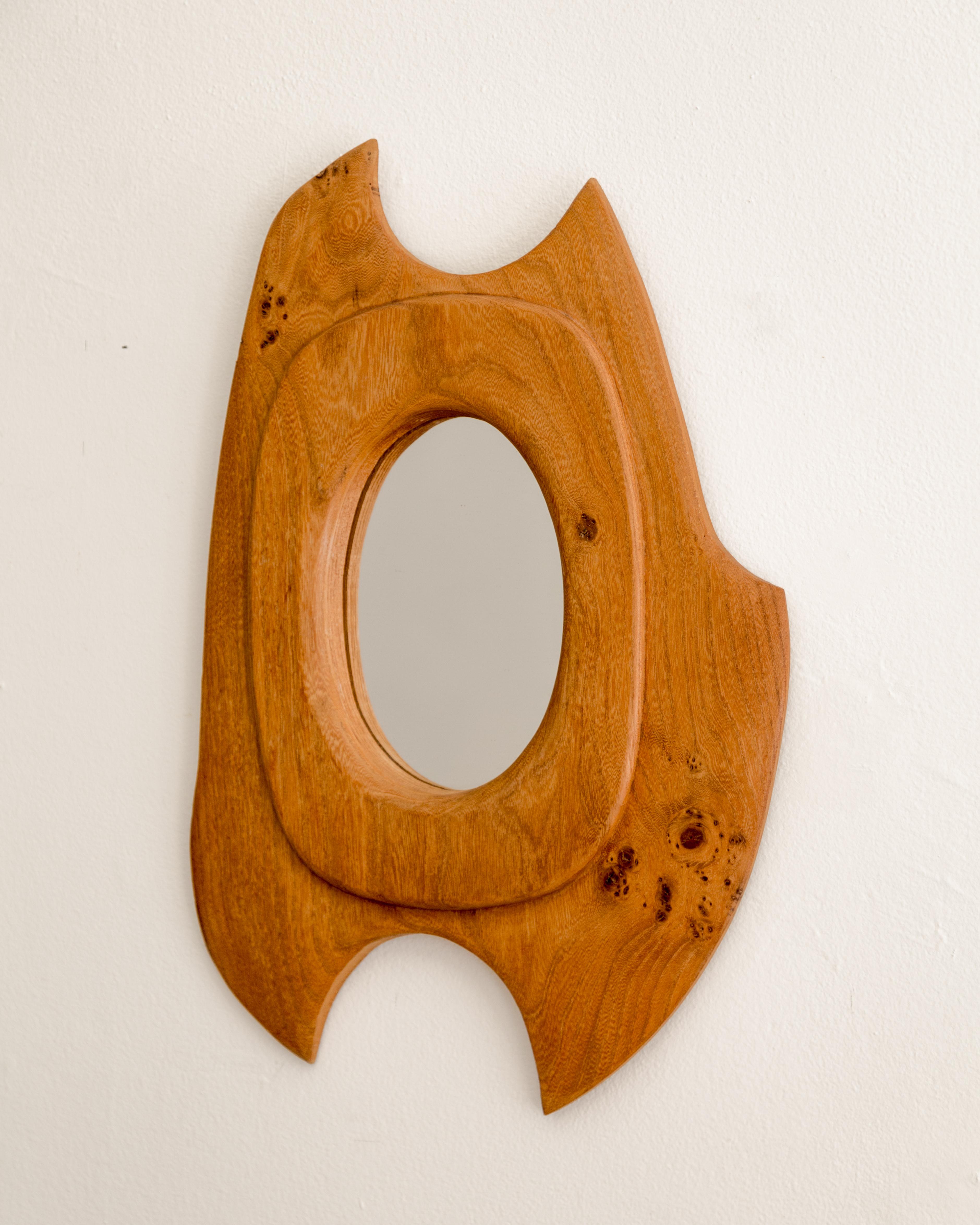 Mod biomorphic walnut shaped mirror, France circa 1960's.