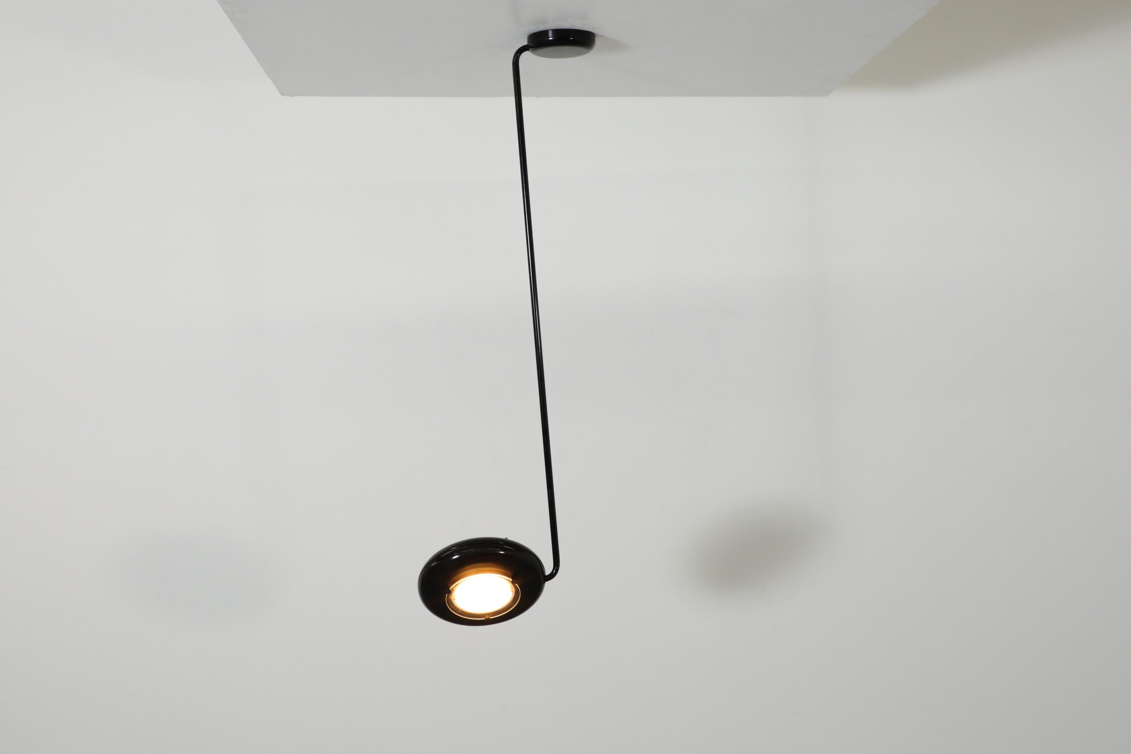 MOD black ceiling mount light with dimmable halogen bulb inspired by Tommaso Cimini's 'Elle' lamps of 1984. This strikingly designed flush mount lamp is adjustable as the arm swings back and forth and has a rotating head. It  is as eye catching as