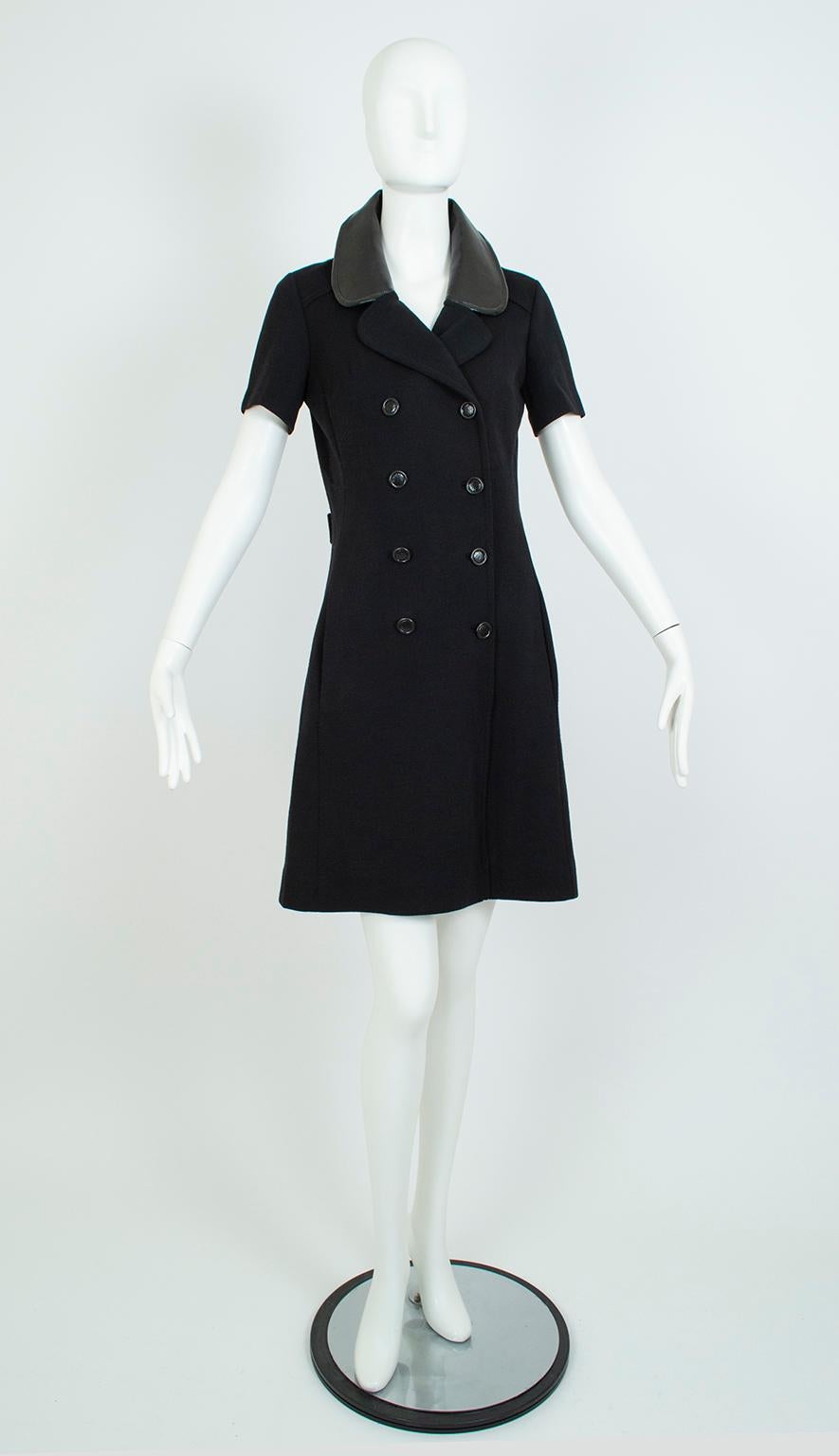 Though Courrèges owned the vinyl-trimmed sportswear rage of the early 60s, other designers such as this one executed it with similar aplomb. With its A-line cut, vinyl-covered buttons and collar and mini length, this killer frock is