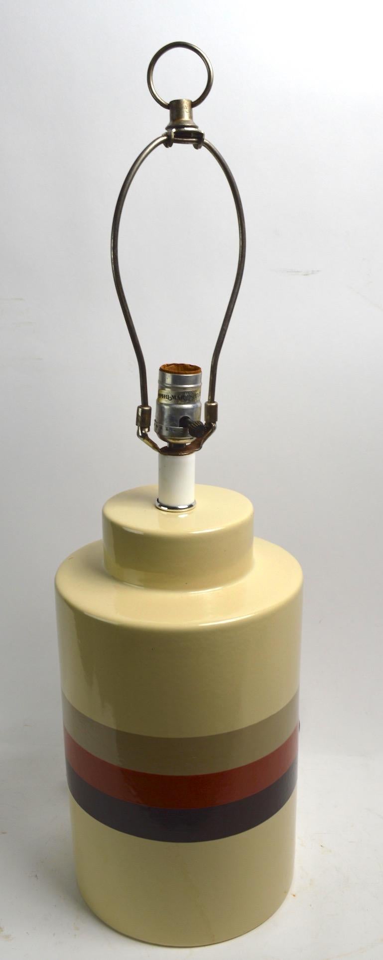 Mod style banded ceramic table lamp by Philmar Sandel. Original, clean and working condition, shade not included.
Height to top of ceramic body 14